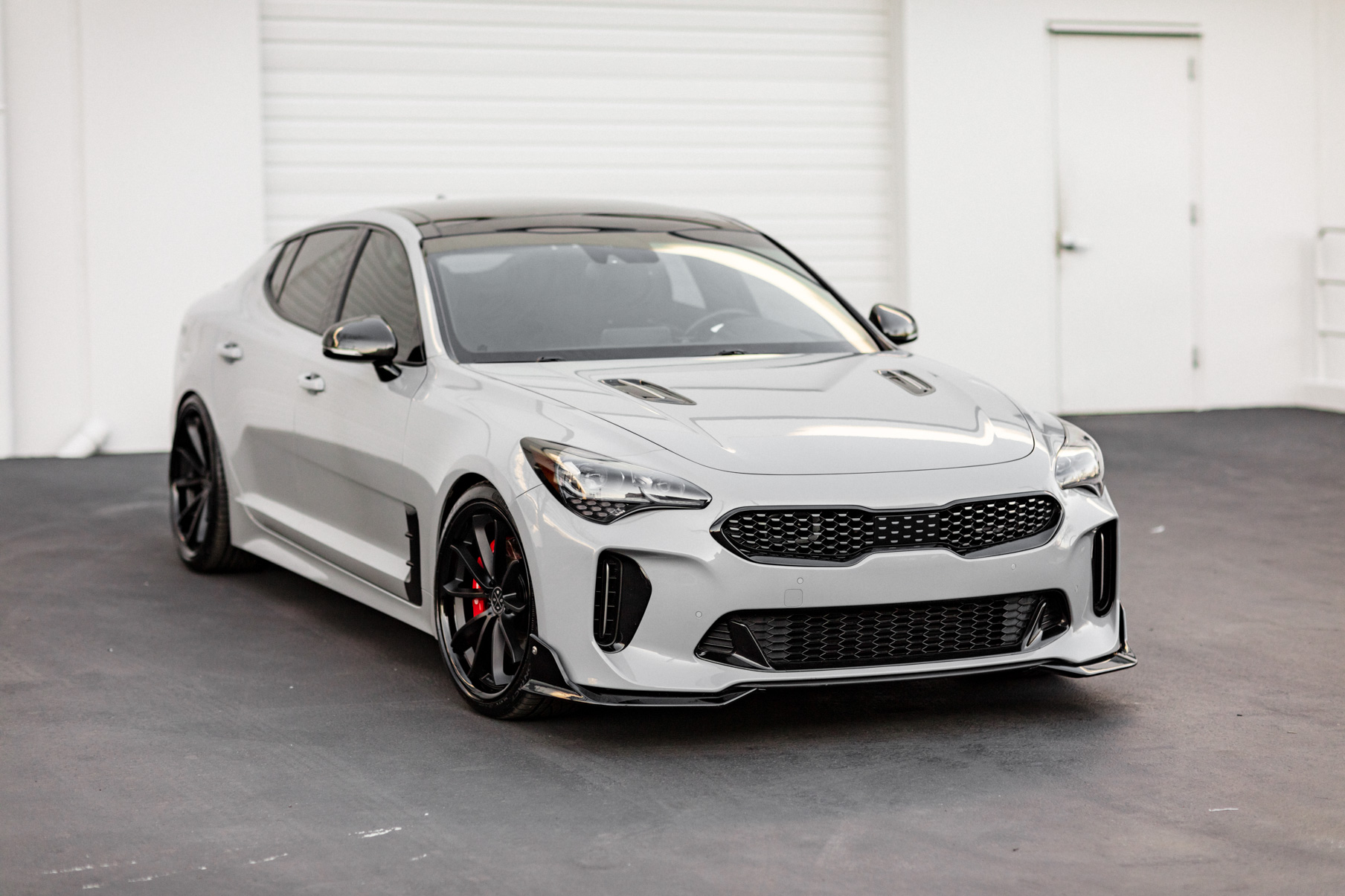 A 2018 Kia Stinger on 20 Inch Blaque Diamond BD-23 Gloss Black Wheels