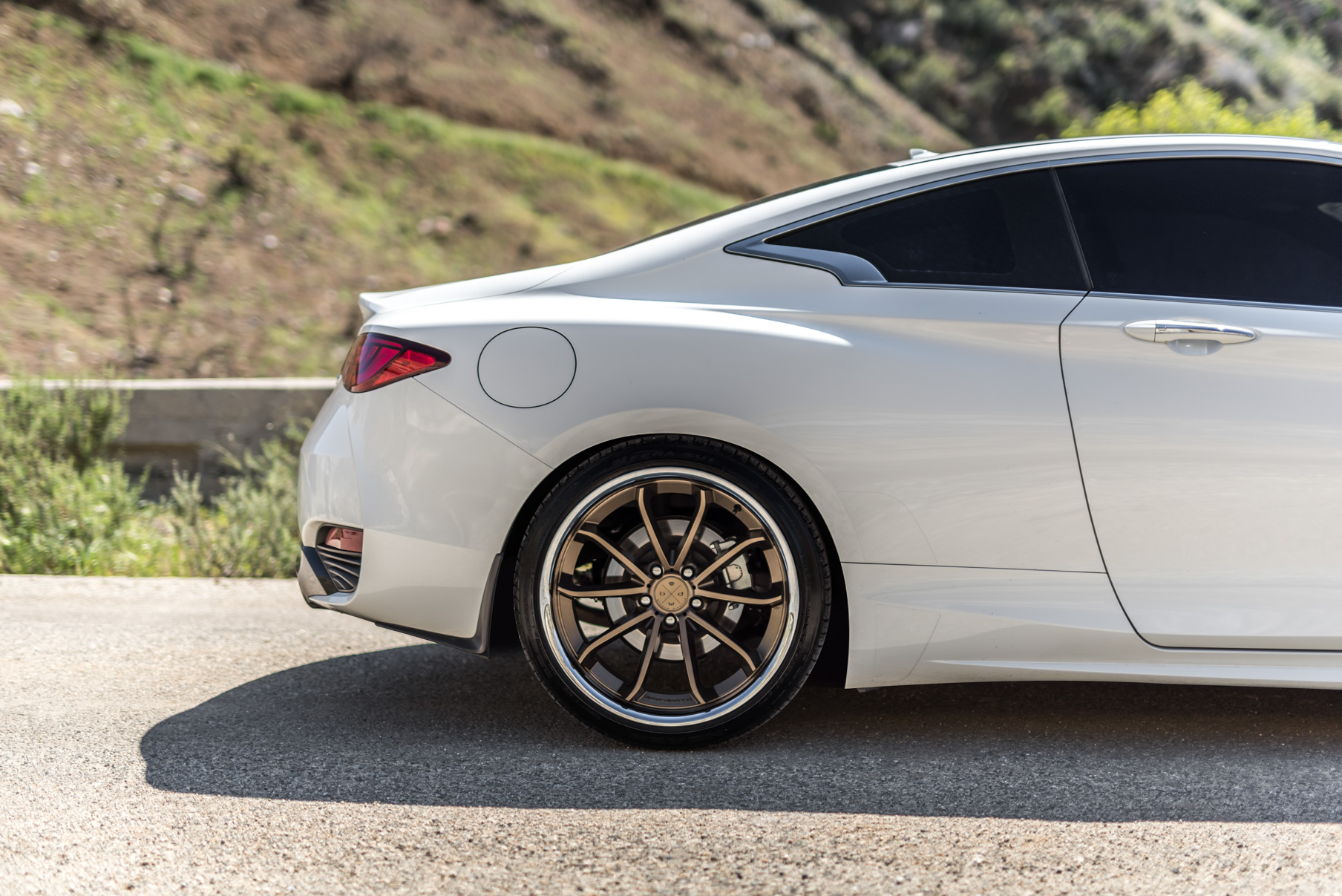 A White 2017 Infiniti Q60 on BD-23 20 Inch Bronze Chrome SS Lip Staggered Wheels