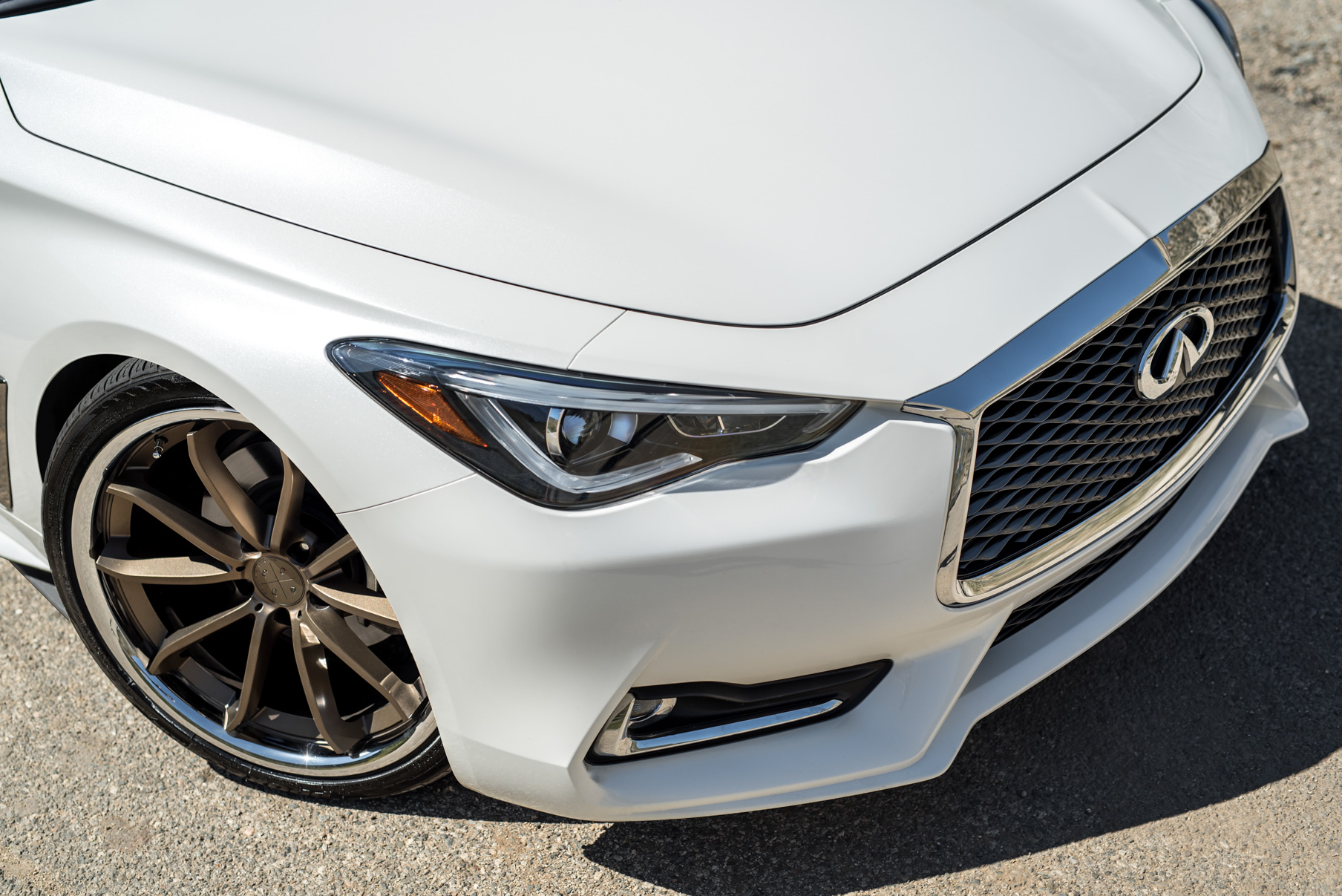 A White 2017 Infiniti Q60 on BD-23 20 Inch Bronze Chrome SS Lip Staggered Wheels