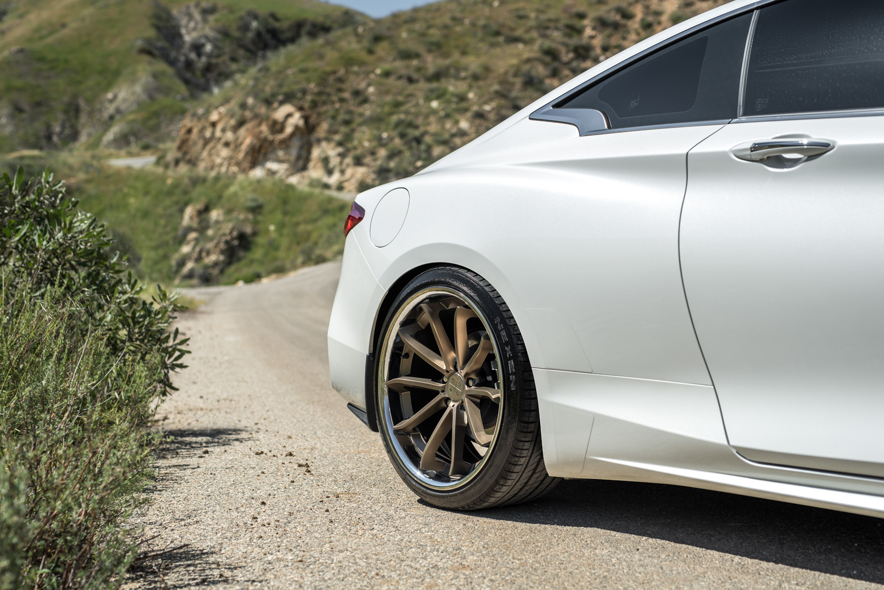 A White 2017 Infiniti Q60 on BD-23 20 Inch Bronze Chrome SS Lip Staggered Wheels