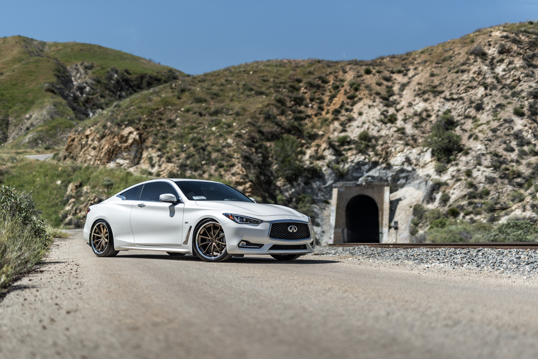 A White 2017 Infiniti Q60 on BD-23 20 Inch Bronze Chrome SS Lip Staggered Wheels