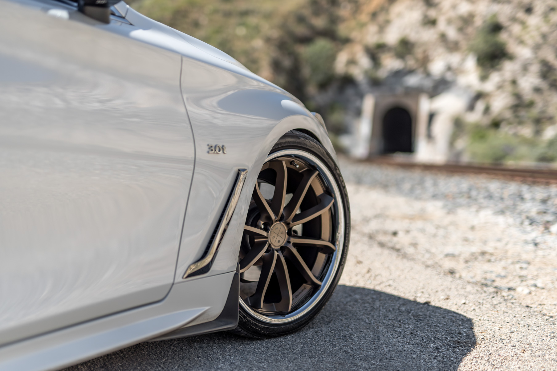 A White 2017 Infiniti Q60 on BD-23 20 Inch Bronze Chrome SS Lip Staggered Wheels