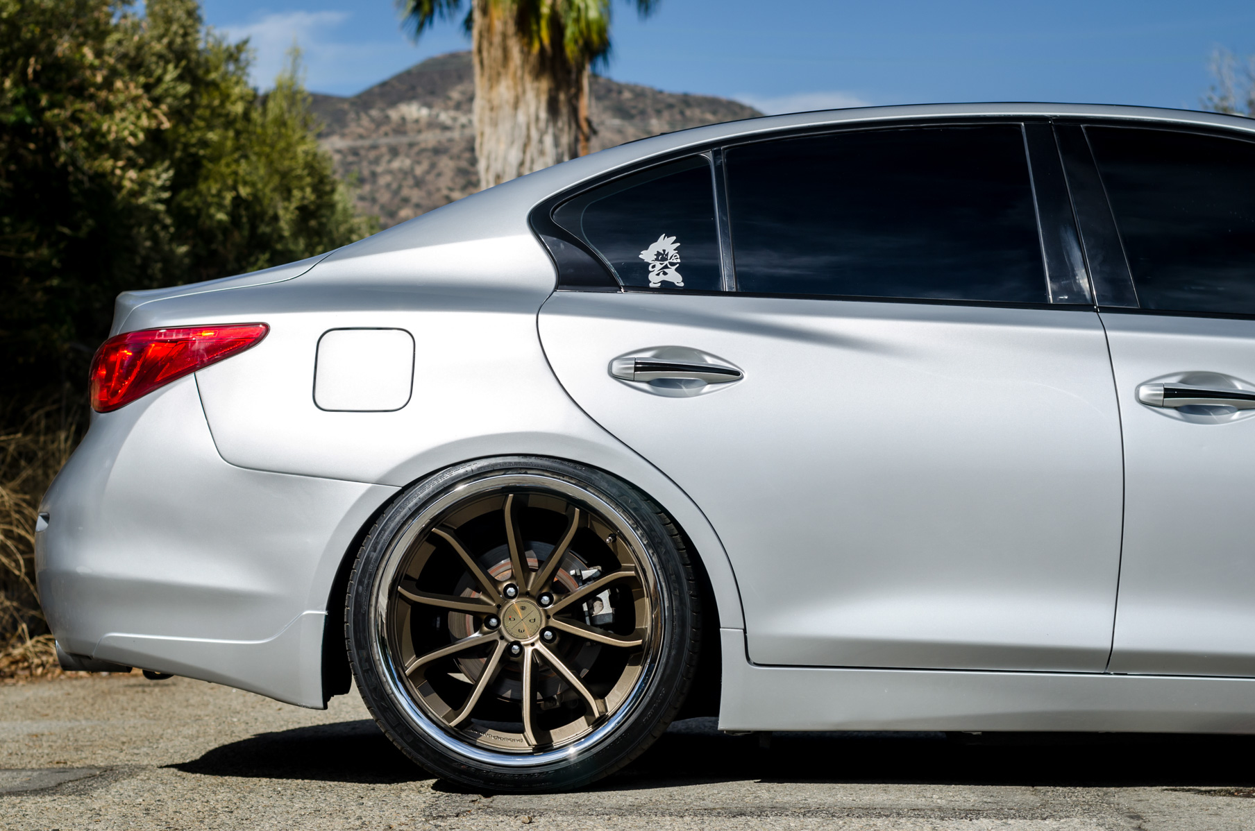 A Silver 2014 Infiniti Q50 on Blaque Diamond BD-23 Bronze Chrome Wheels