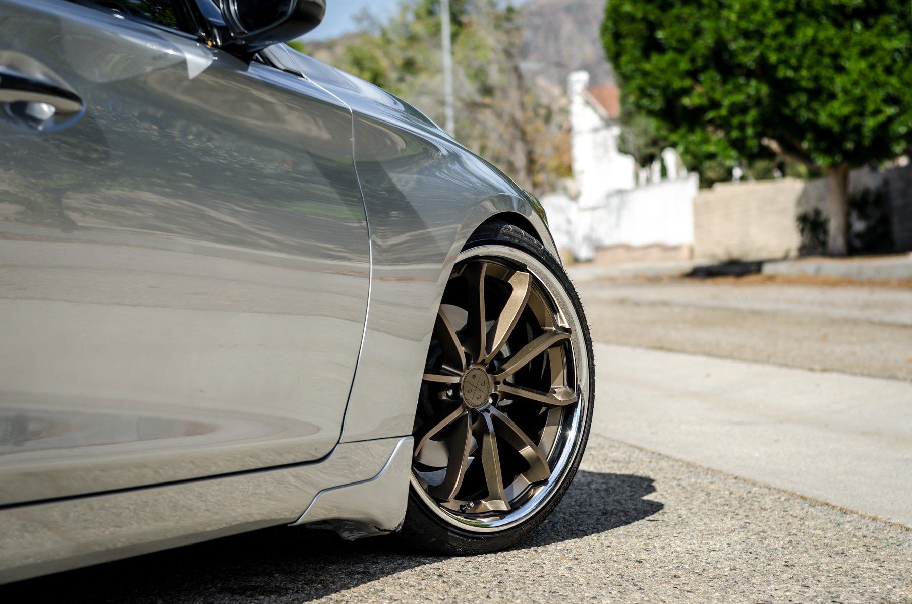 A Silver 2014 Infiniti Q50 on Blaque Diamond BD-23 Bronze Chrome Wheels