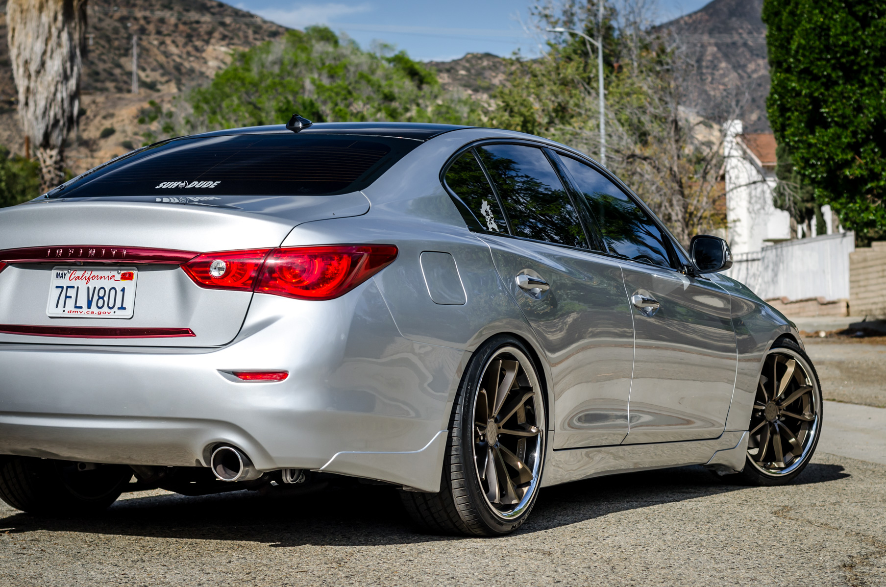 A Silver 2014 Infiniti Q50 on Blaque Diamond BD-23 Bronze Chrome Wheels