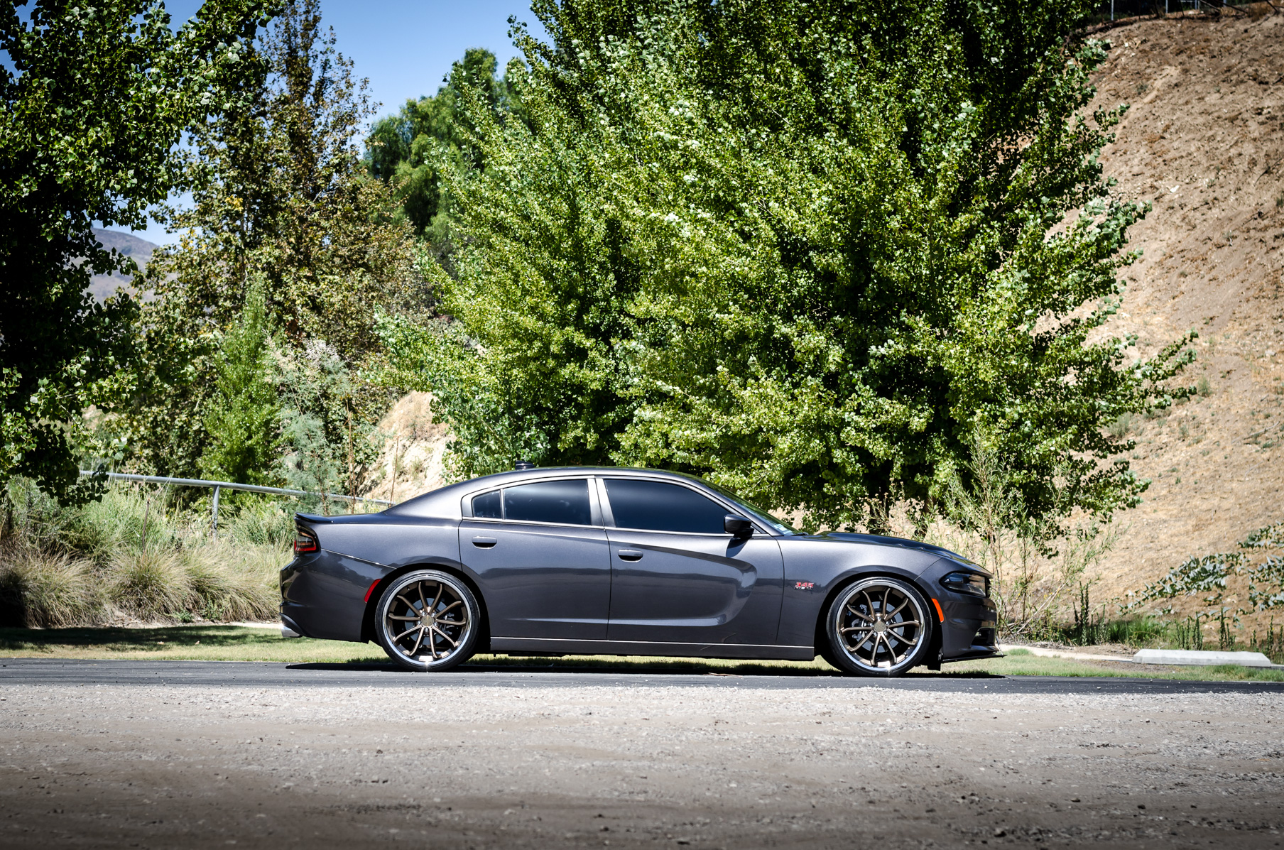 A 2016 Dodge Charger RT on 22 Inch Blaque Diamond BD-23 Bronze with SS Lip Wheels
