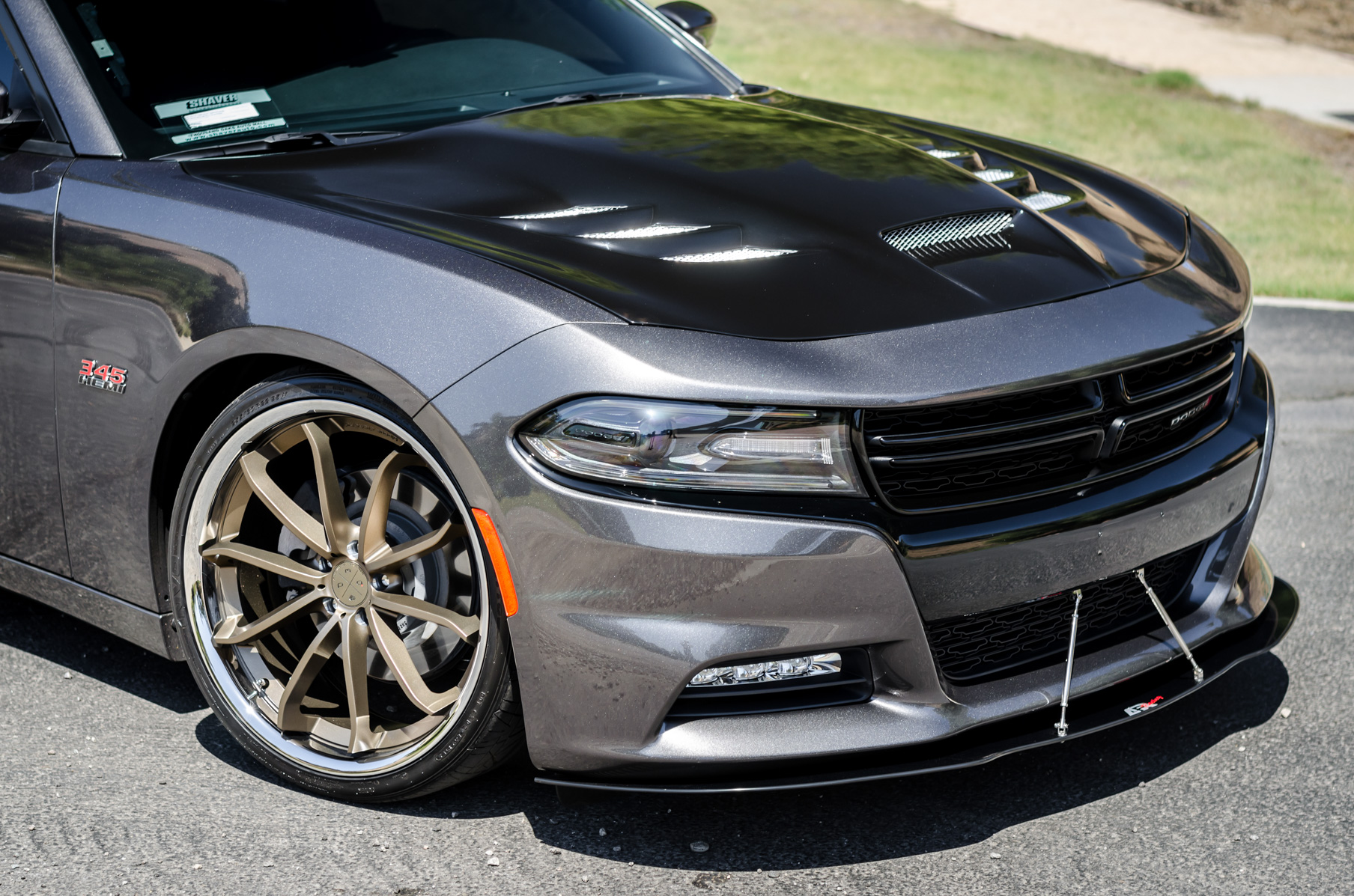 A 2016 Dodge Charger RT on 22 Inch Blaque Diamond BD-23 Bronze with SS Lip Wheels