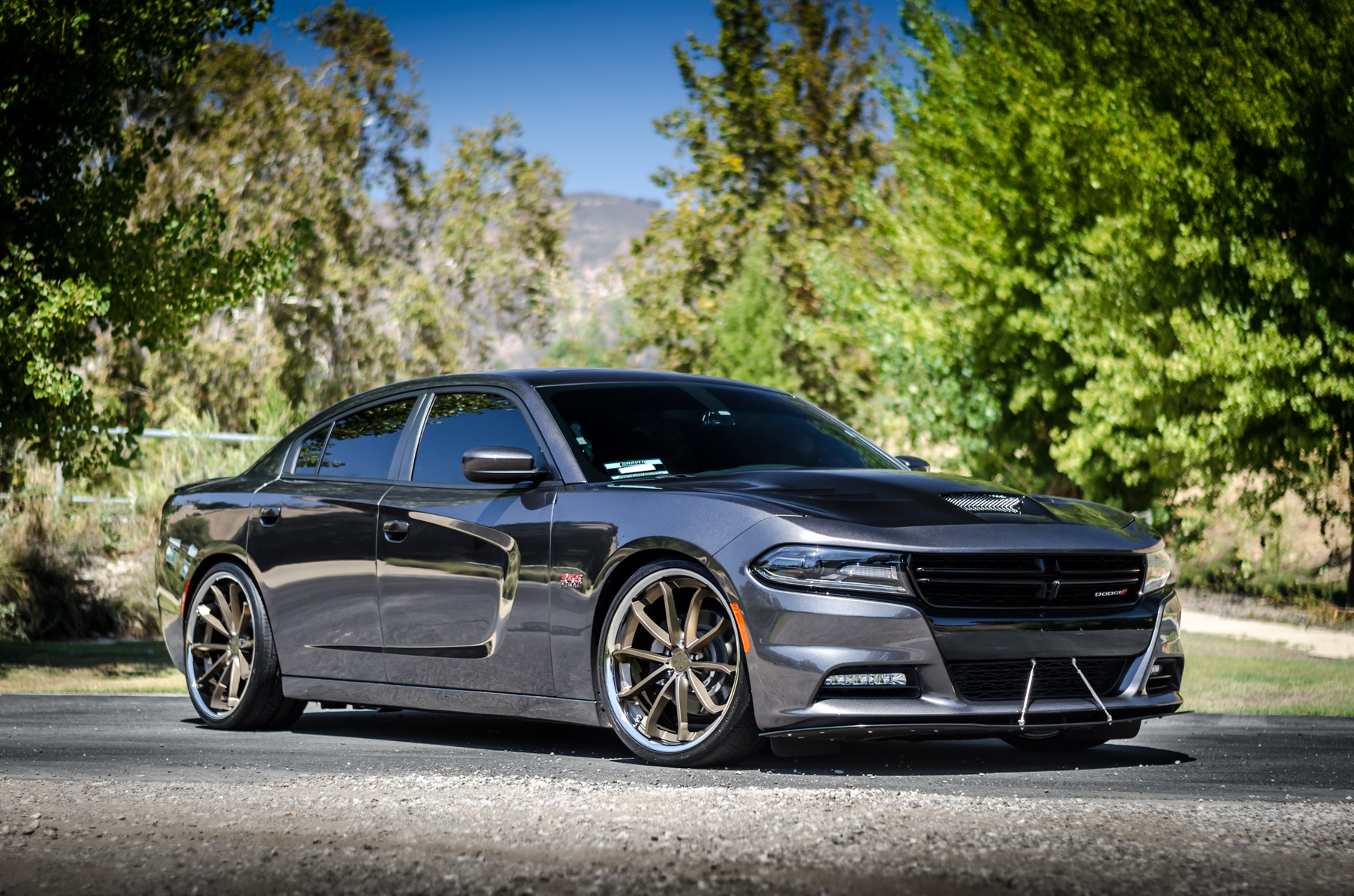 A 2016 Dodge Charger RT on 22 Inch Blaque Diamond BD-23 Bronze with SS Lip Wheels