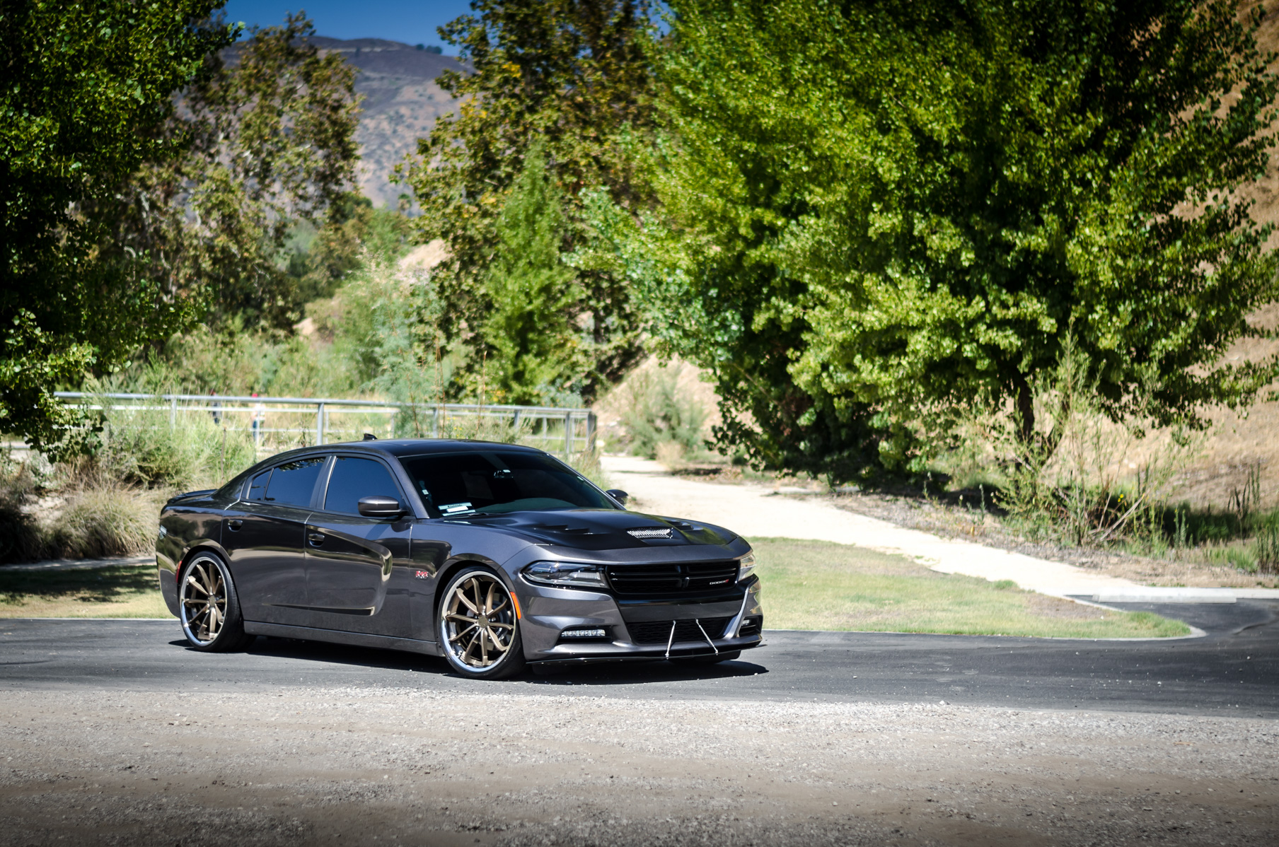 A 2016 Dodge Charger RT on 22 Inch Blaque Diamond BD-23 Bronze with SS Lip Wheels