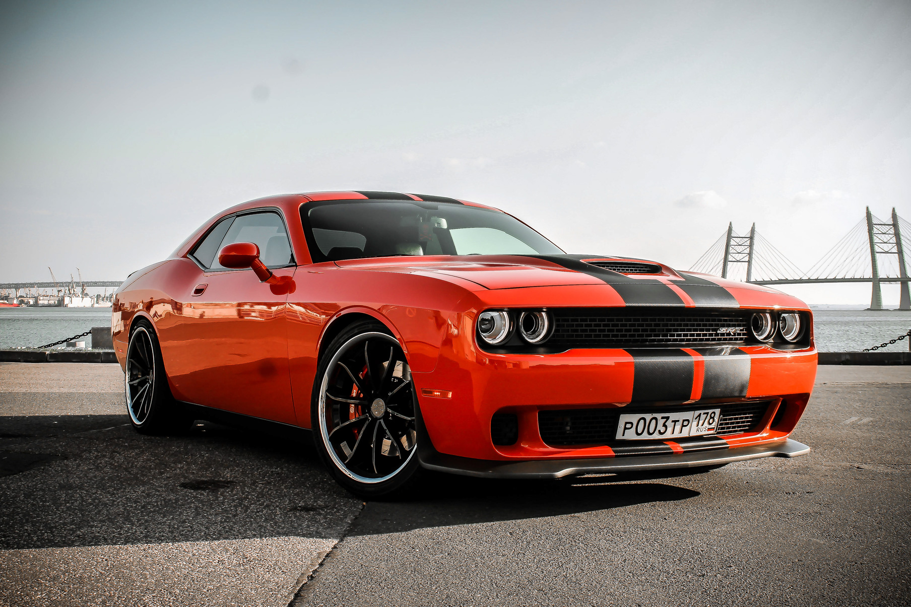 An Orange Dodge Challenger on Blaque Diamond BD-23 Gloss Black Wheel