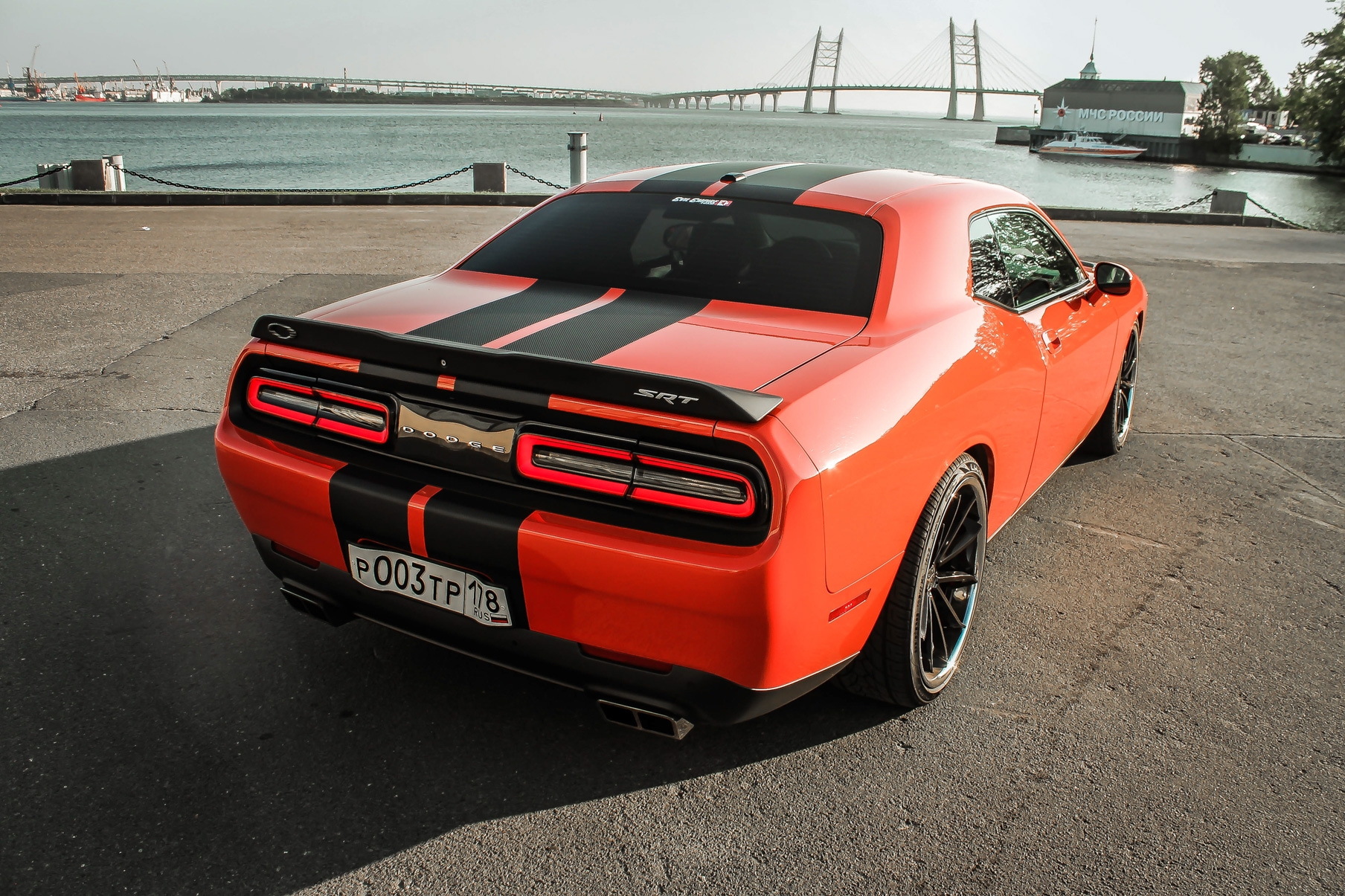 An Orange Dodge Challenger on Blaque Diamond BD-23 Gloss Black Wheel