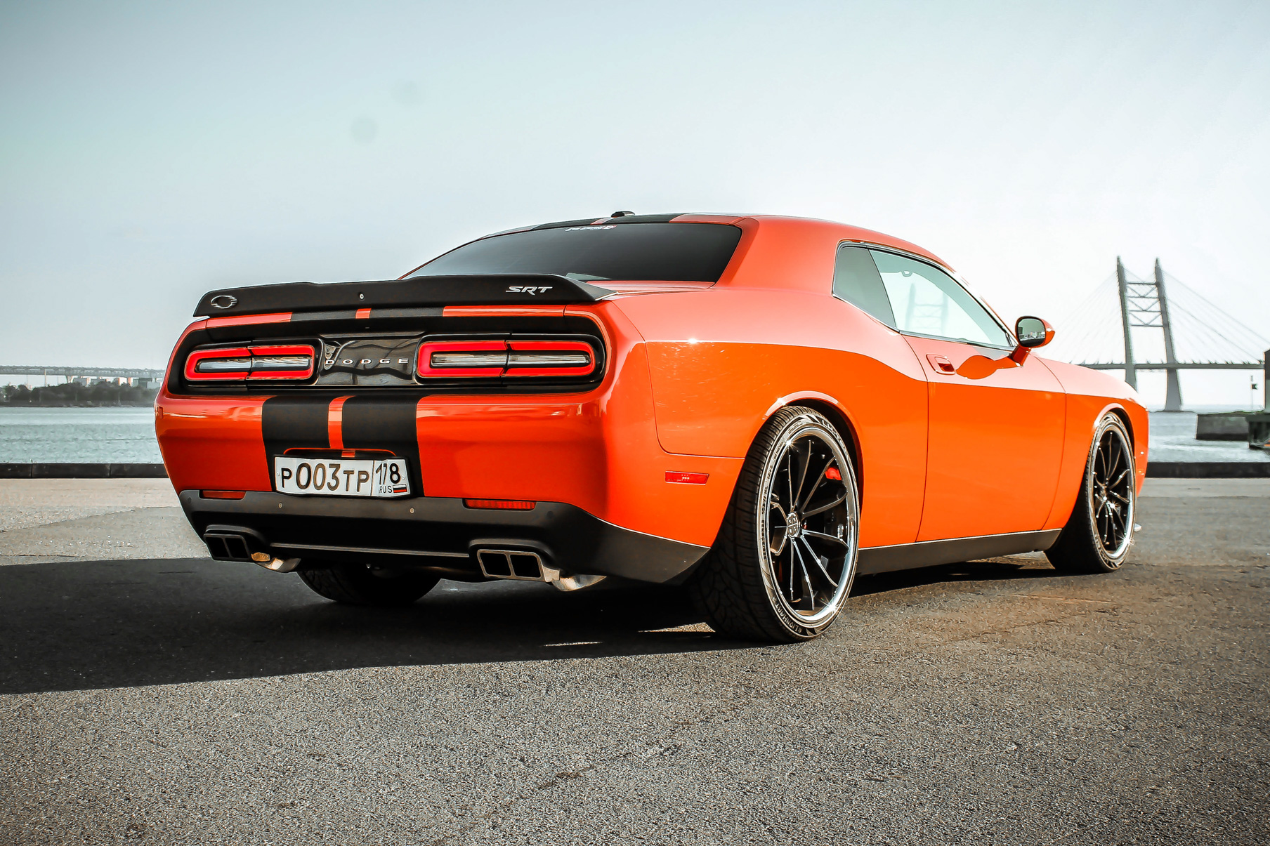 An Orange Dodge Challenger on Blaque Diamond BD-23 Gloss Black Wheel