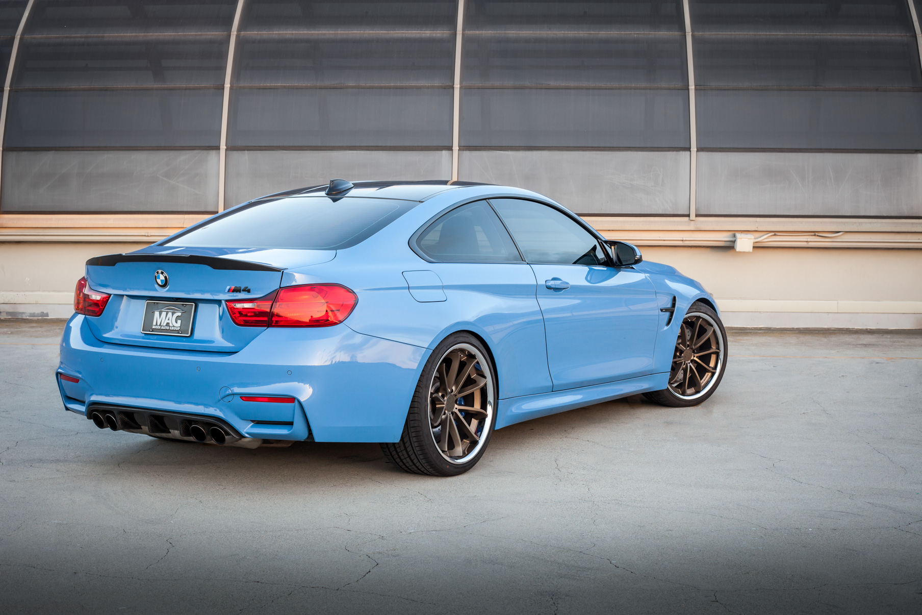 A BMW M4 on 20 Inch Blaque Diamond BD-23 Bronze Wheels