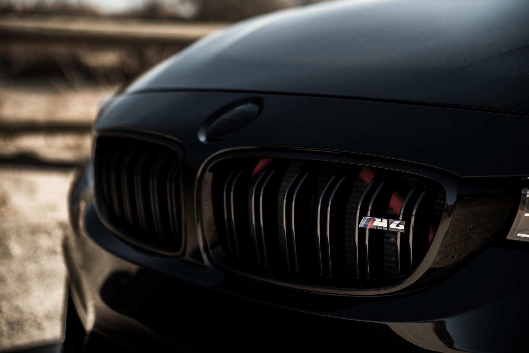 A 2015 BMW M4 on Staggered Blaque Diamond BD-23 Silver Wheels