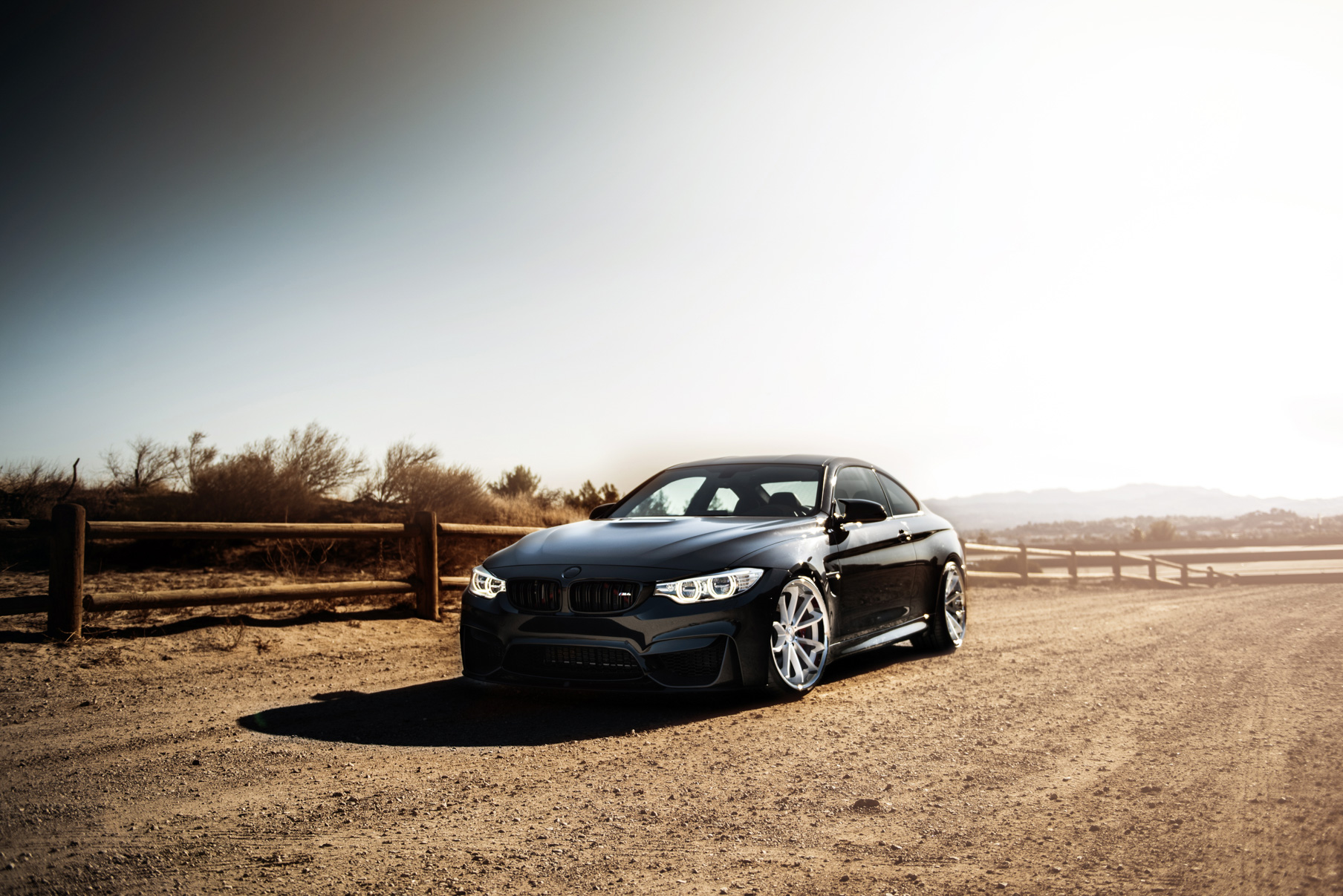 A 2015 BMW M4 on Staggered Blaque Diamond BD-23 Silver Wheels