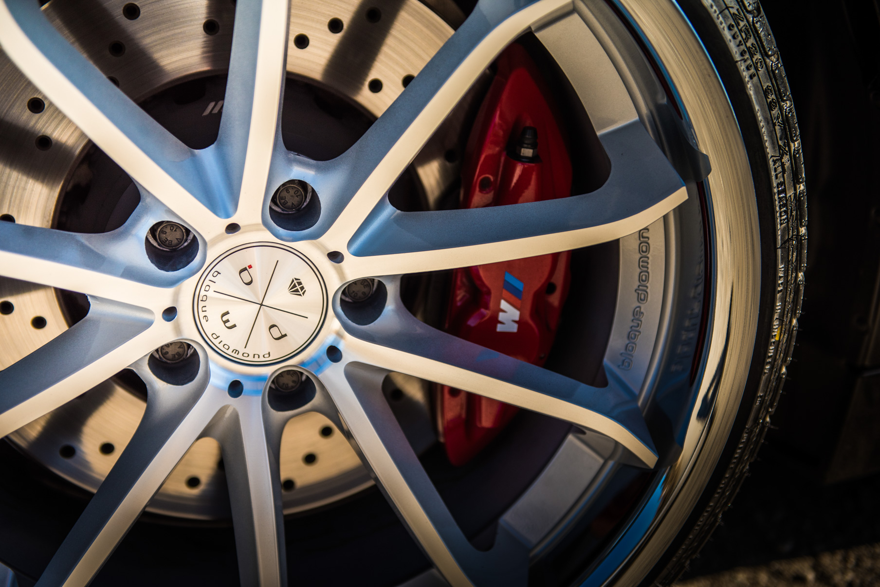 A 2015 BMW M4 on Staggered Blaque Diamond BD-23 Silver Wheels