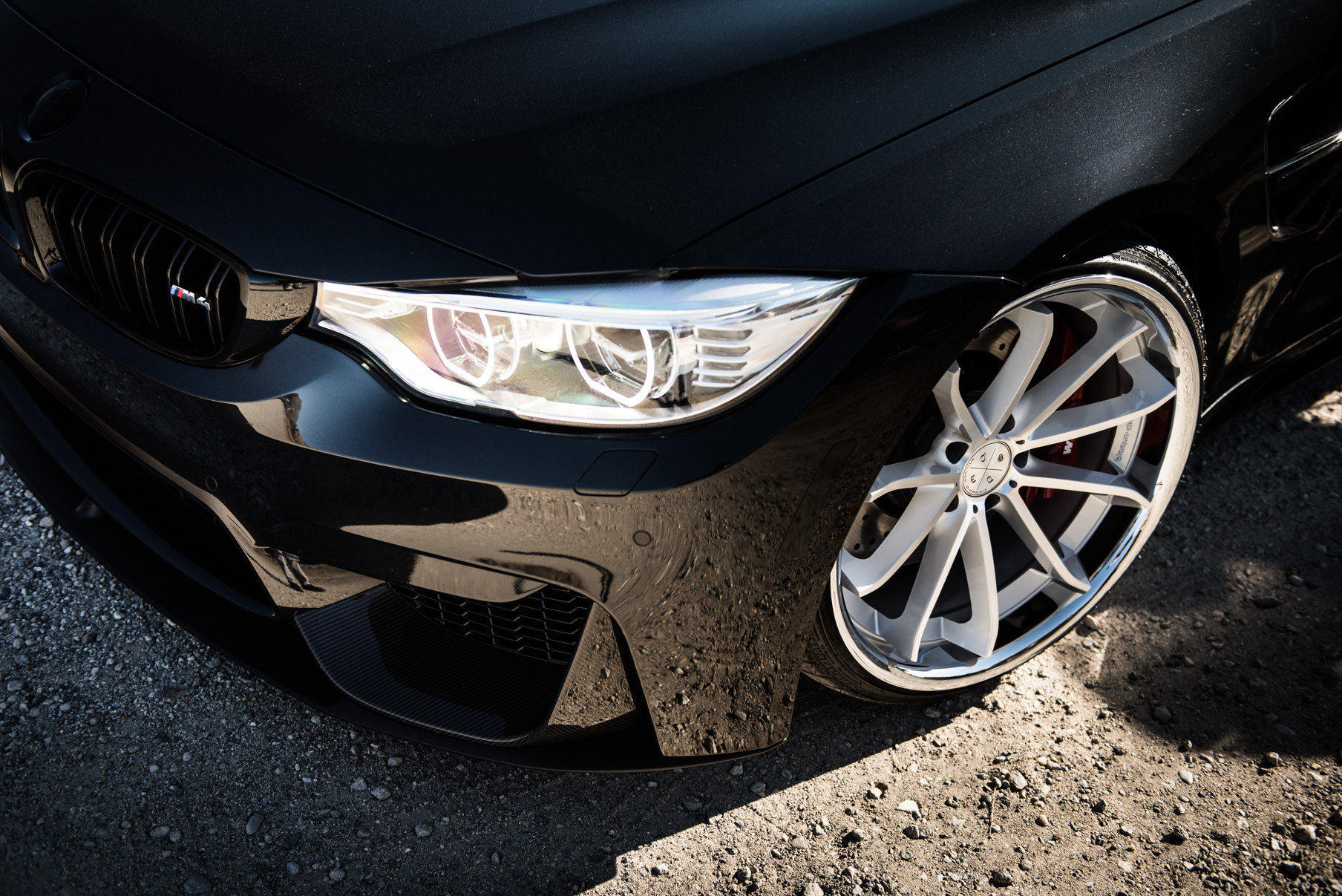 A 2015 BMW M4 on Staggered Blaque Diamond BD-23 Silver Wheels