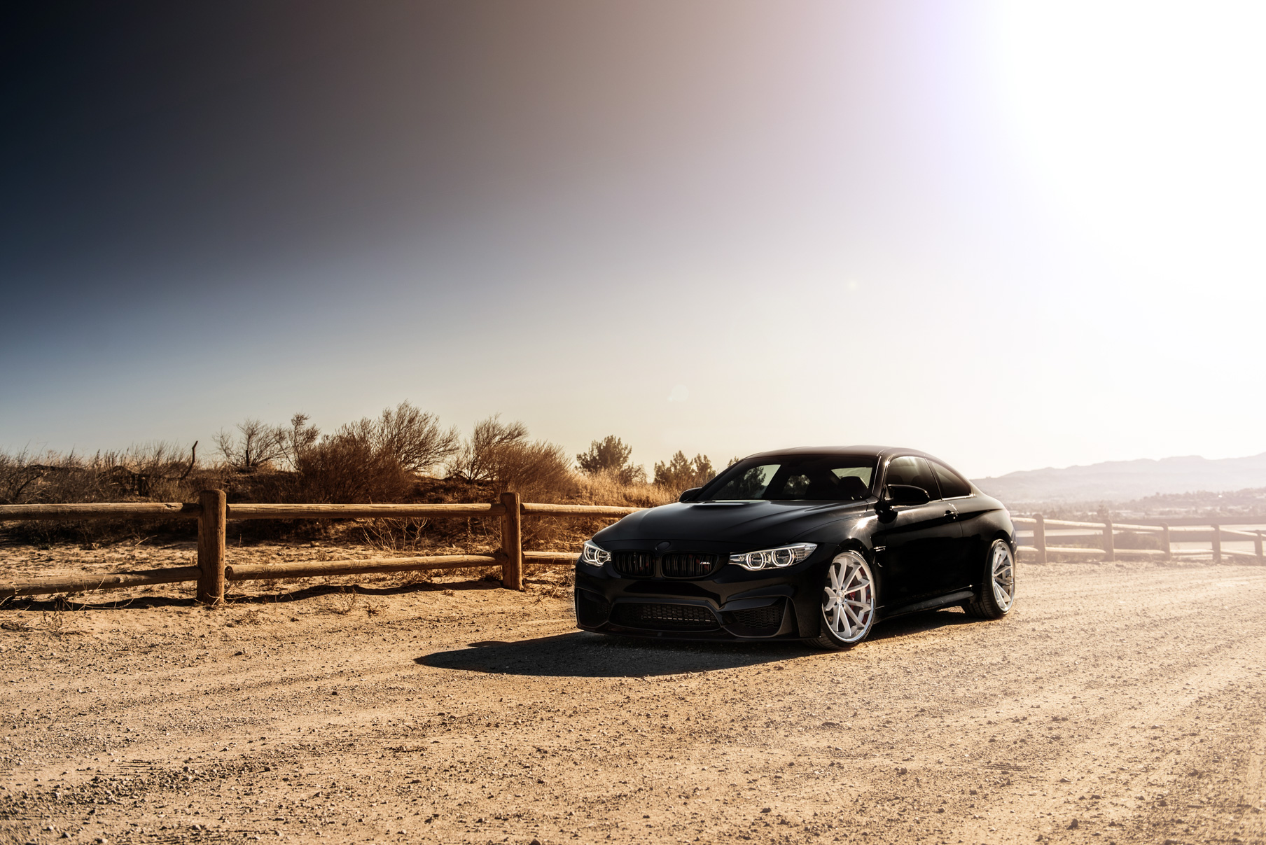 A 2015 BMW M4 on Staggered Blaque Diamond BD-23 Silver Wheels