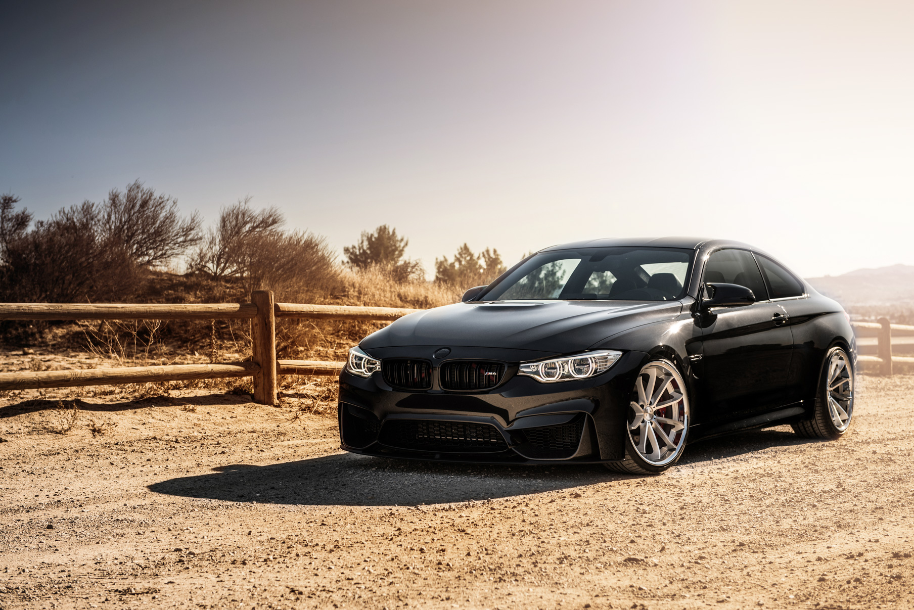 A 2015 BMW M4 on Staggered Blaque Diamond BD-23 Silver Wheels