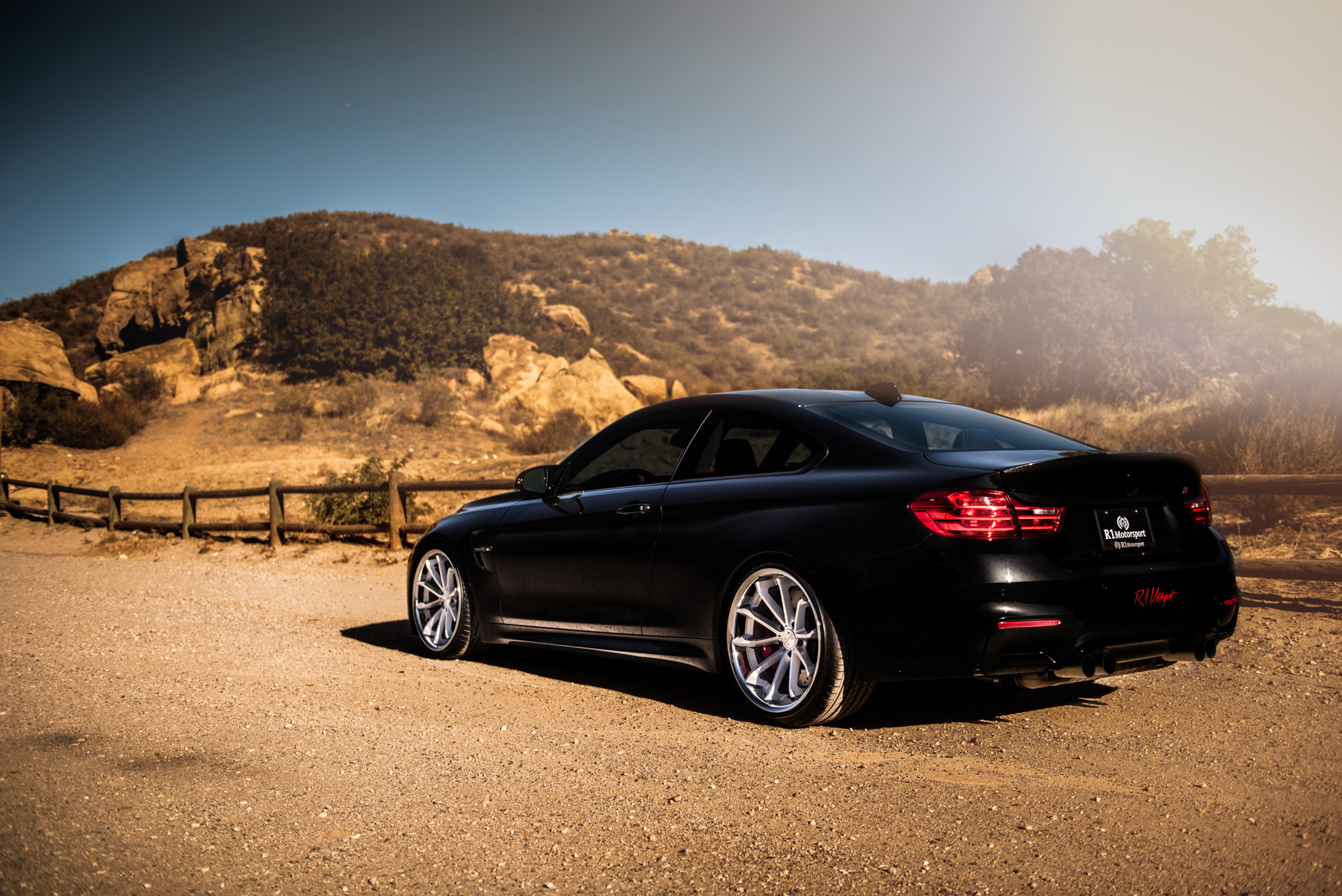 A 2015 BMW M4 on Staggered Blaque Diamond BD-23 Silver Wheels