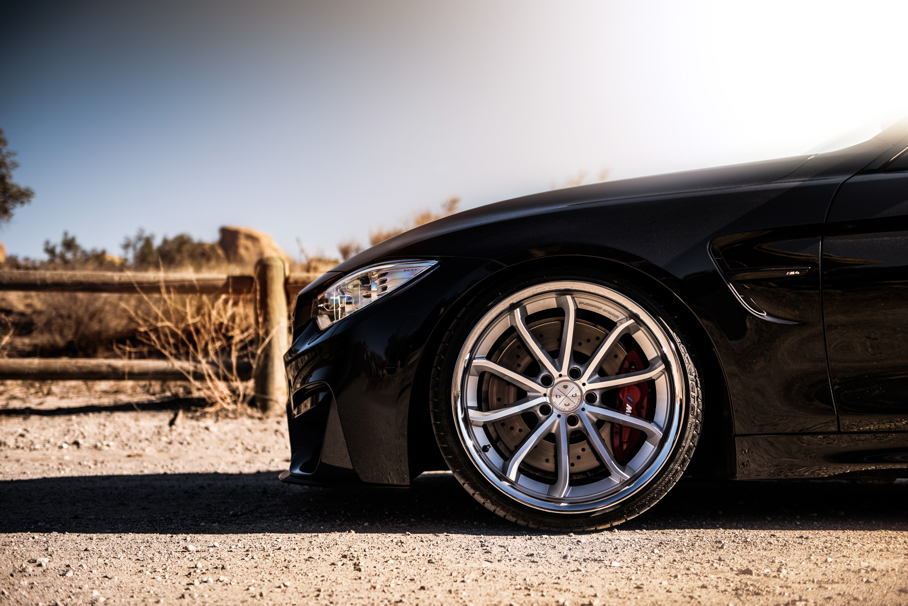 A 2015 BMW M4 on Staggered Blaque Diamond BD-23 Silver Wheels