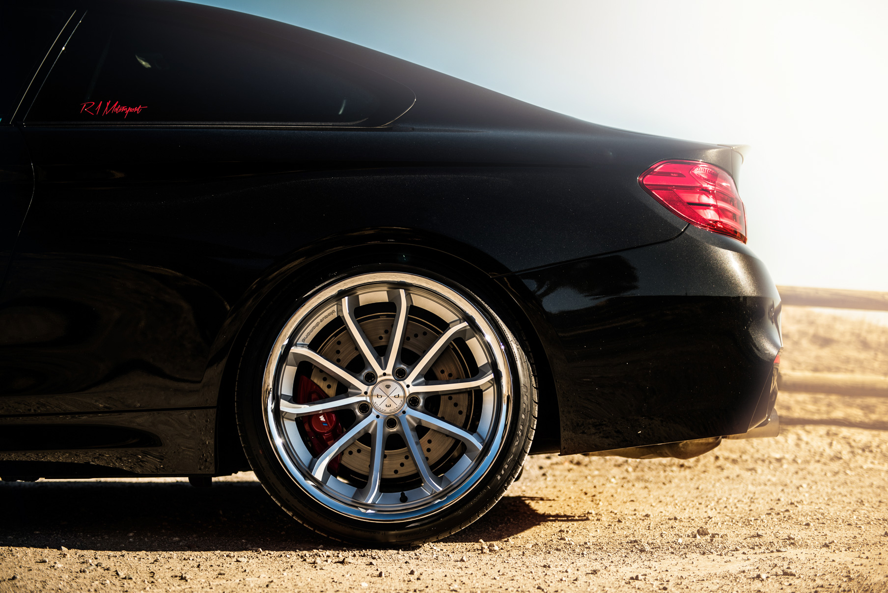 A 2015 BMW M4 on Staggered Blaque Diamond BD-23 Silver Wheels