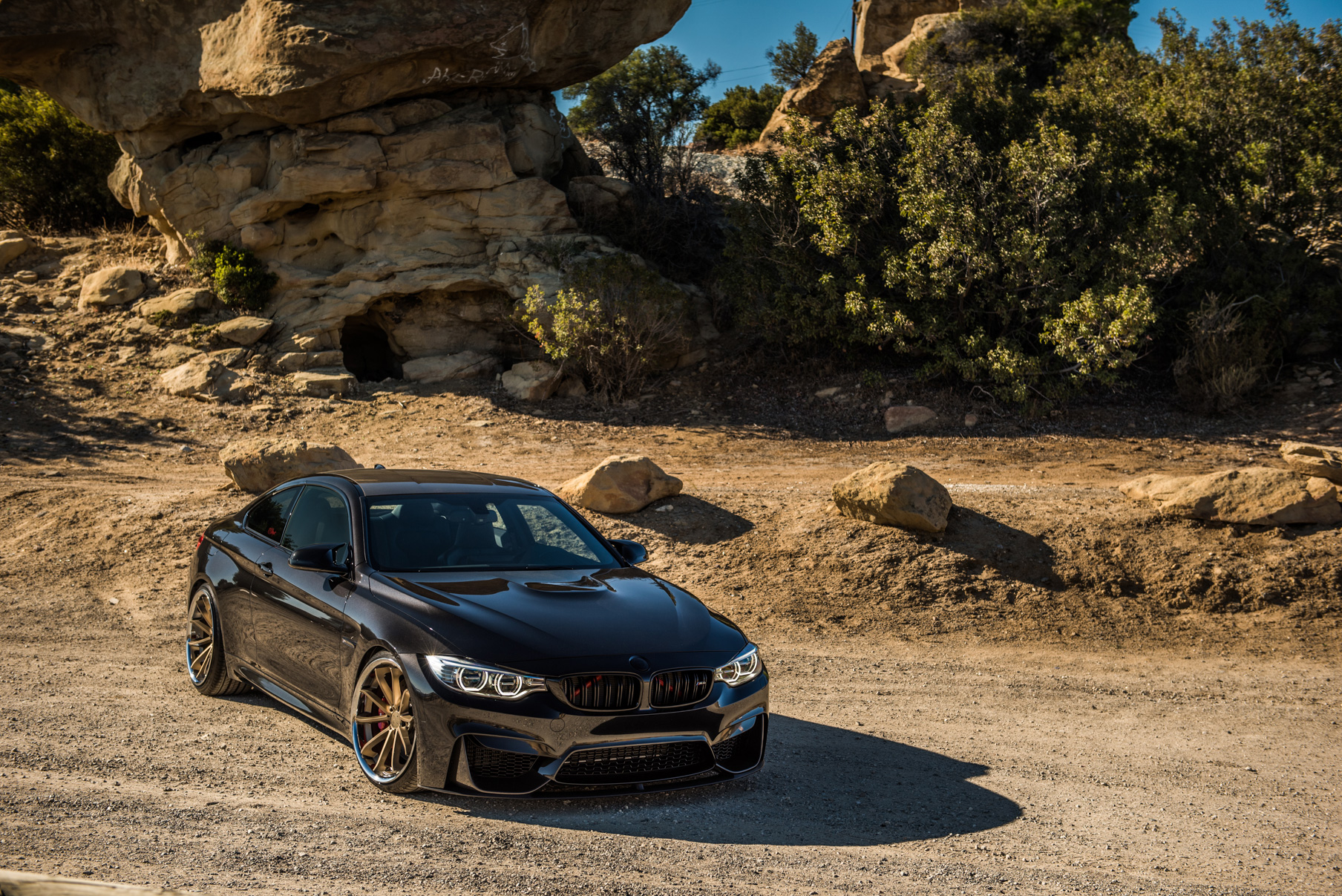 A 2015 BMW M4 on Staggered Blaque Diamond BD-23 Matte Bronze Wheels