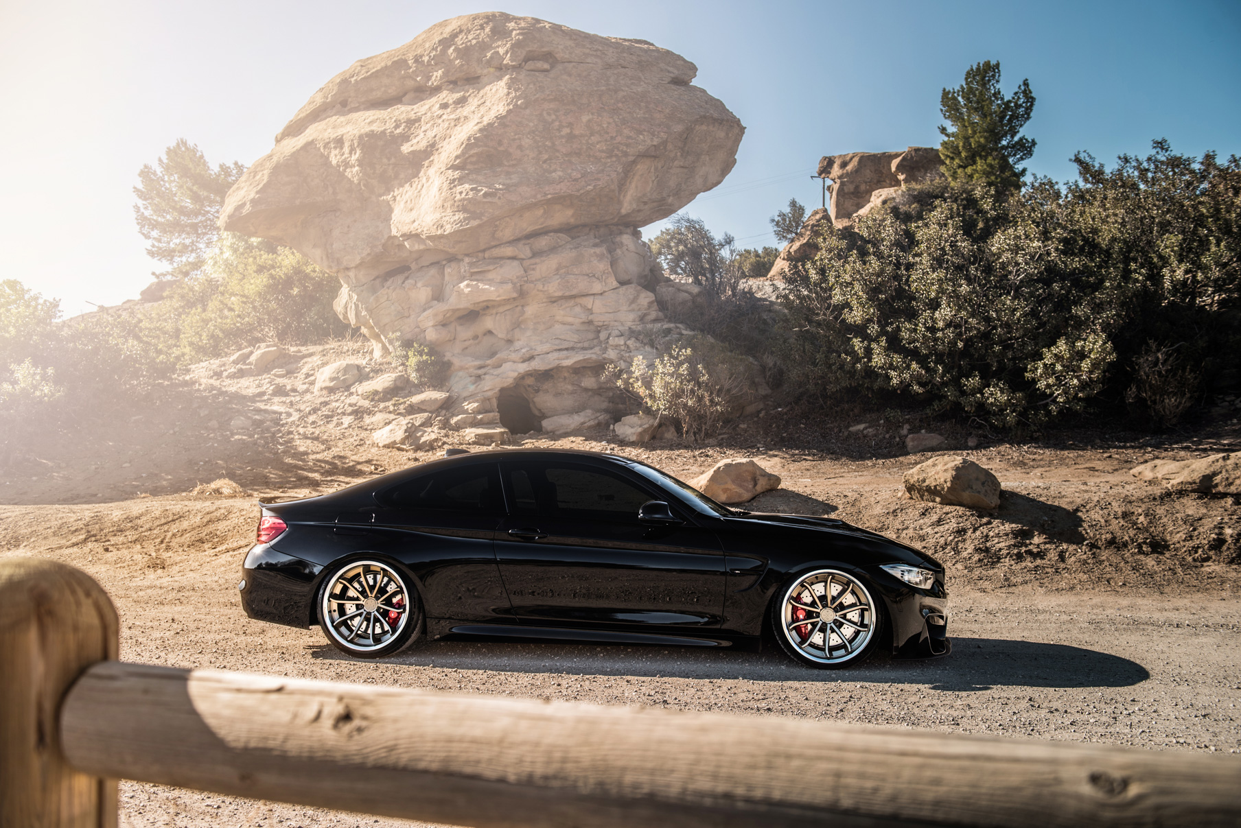 A 2015 BMW M4 on Staggered Blaque Diamond BD-23 Matte Bronze Wheels