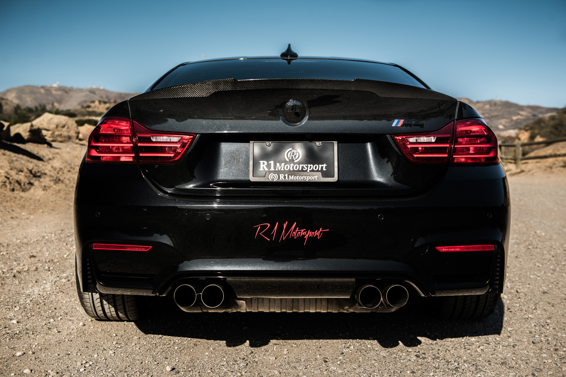 A 2015 BMW M4 on Staggered Blaque Diamond BD-23 Matte Bronze Wheels
