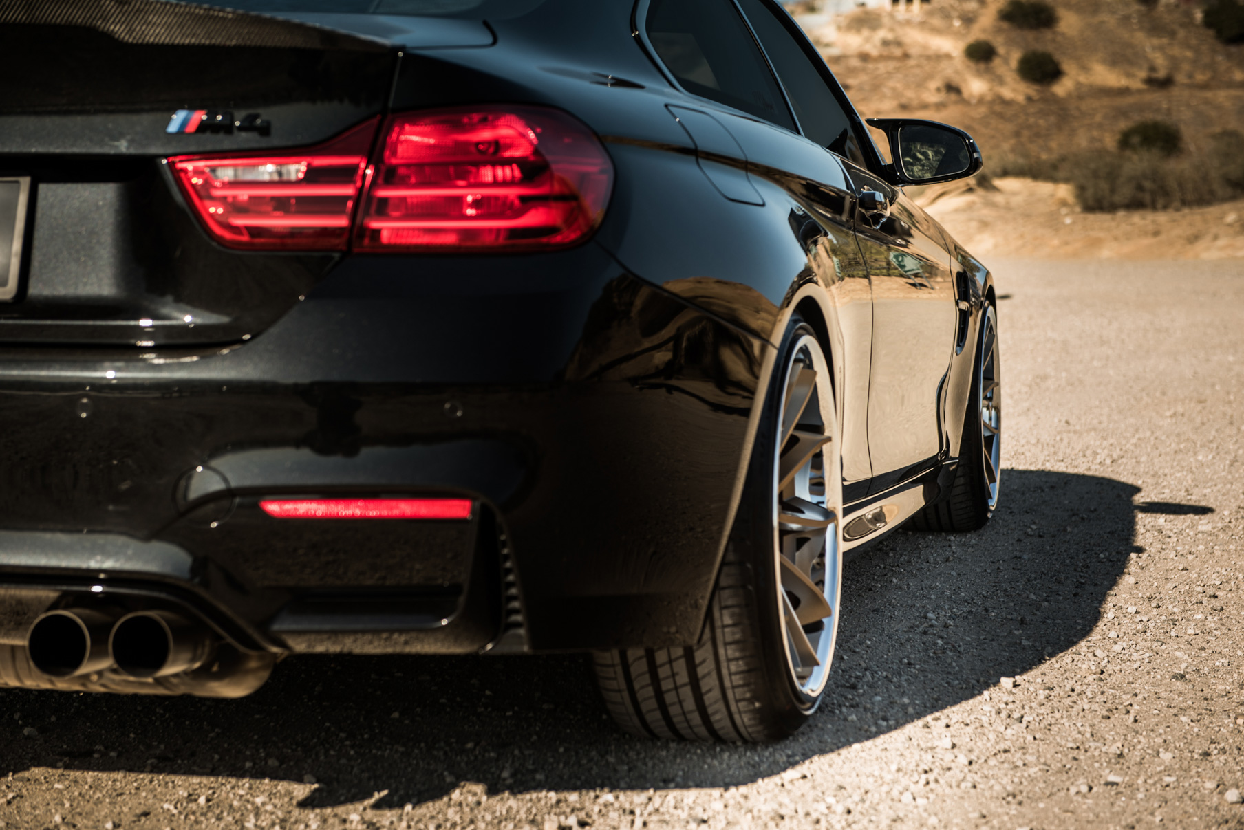 A 2015 BMW M4 on Staggered Blaque Diamond BD-23 Matte Bronze Wheels