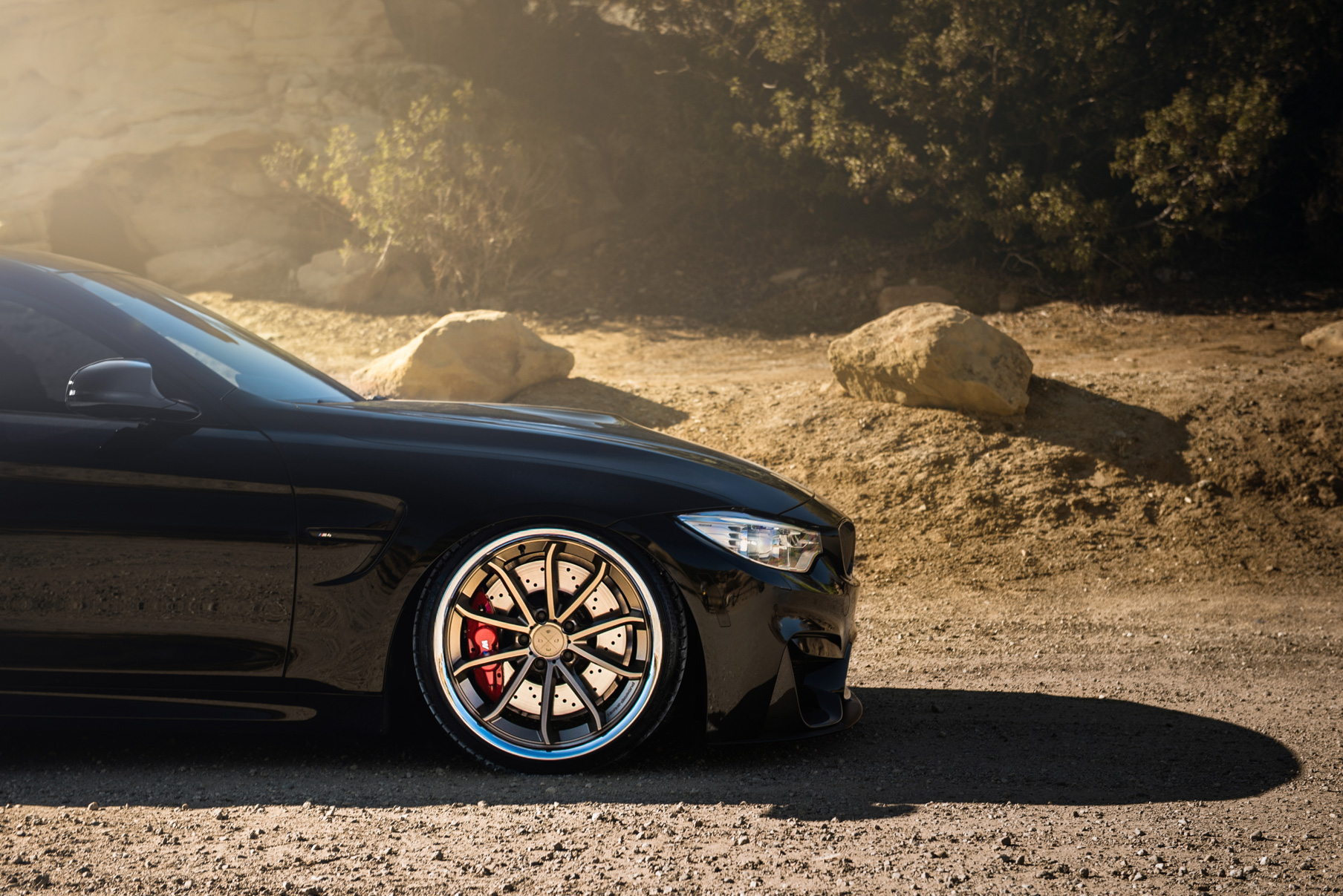 A 2015 BMW M4 on Staggered Blaque Diamond BD-23 Matte Bronze Wheels