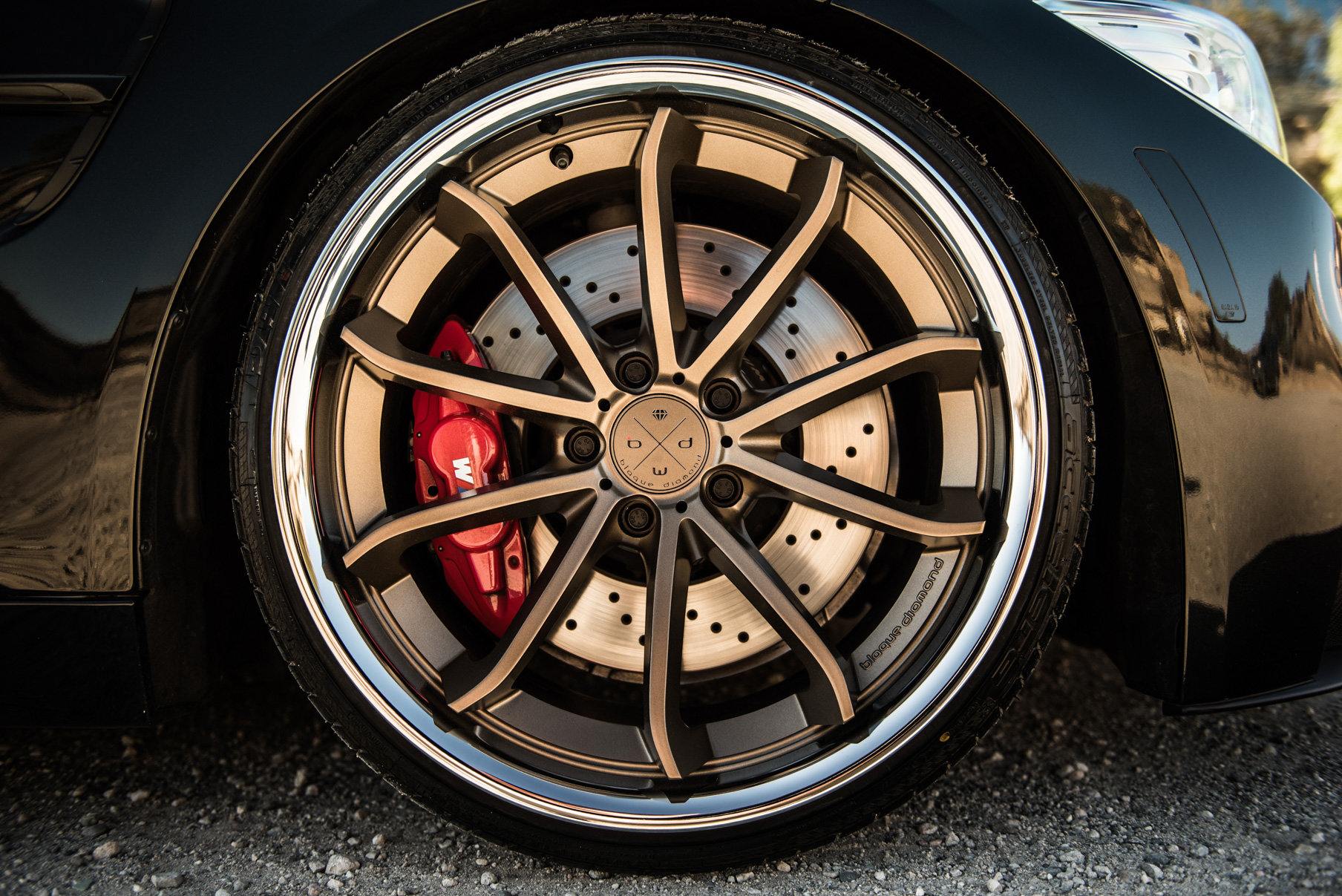 A 2015 BMW M4 on Staggered Blaque Diamond BD-23 Matte Bronze Wheels