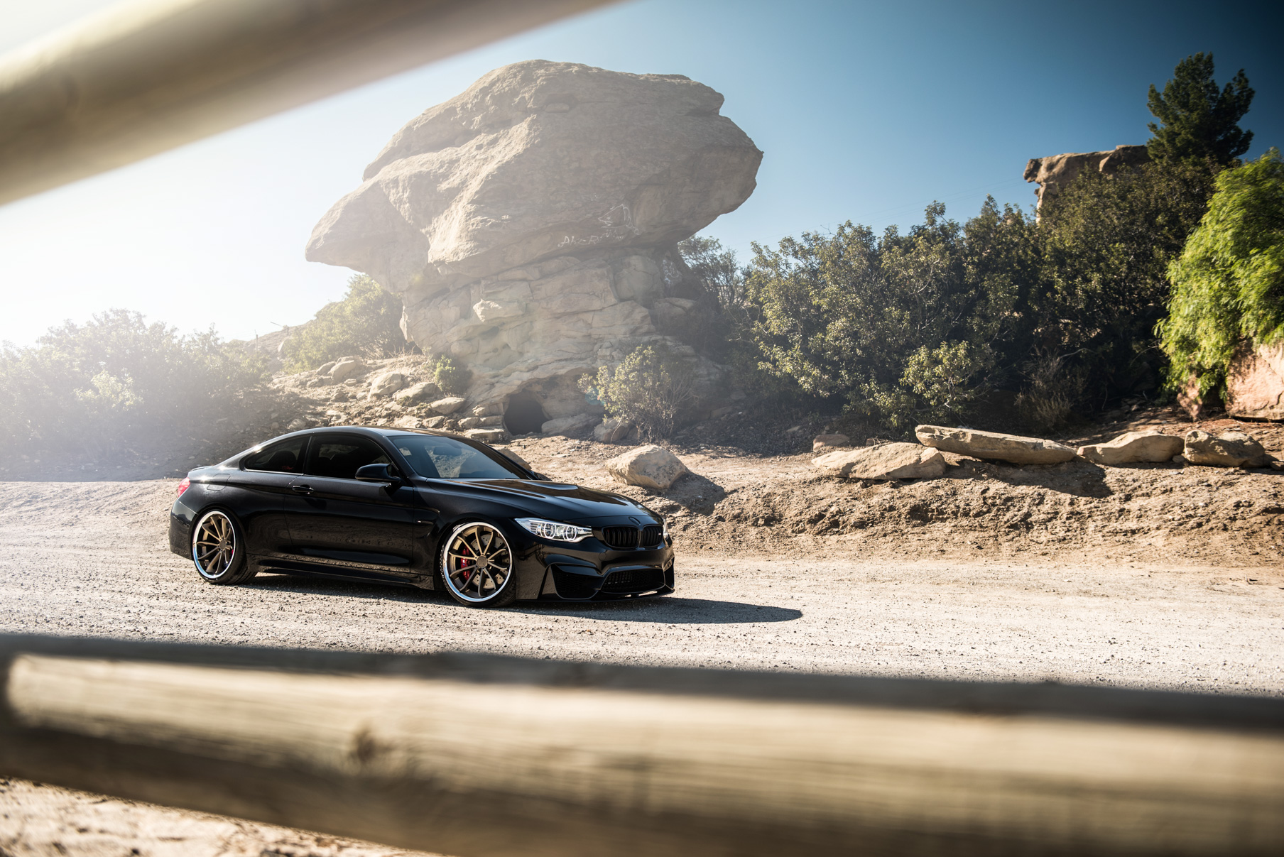 A 2015 BMW M4 on Staggered Blaque Diamond BD-23 Matte Bronze Wheels
