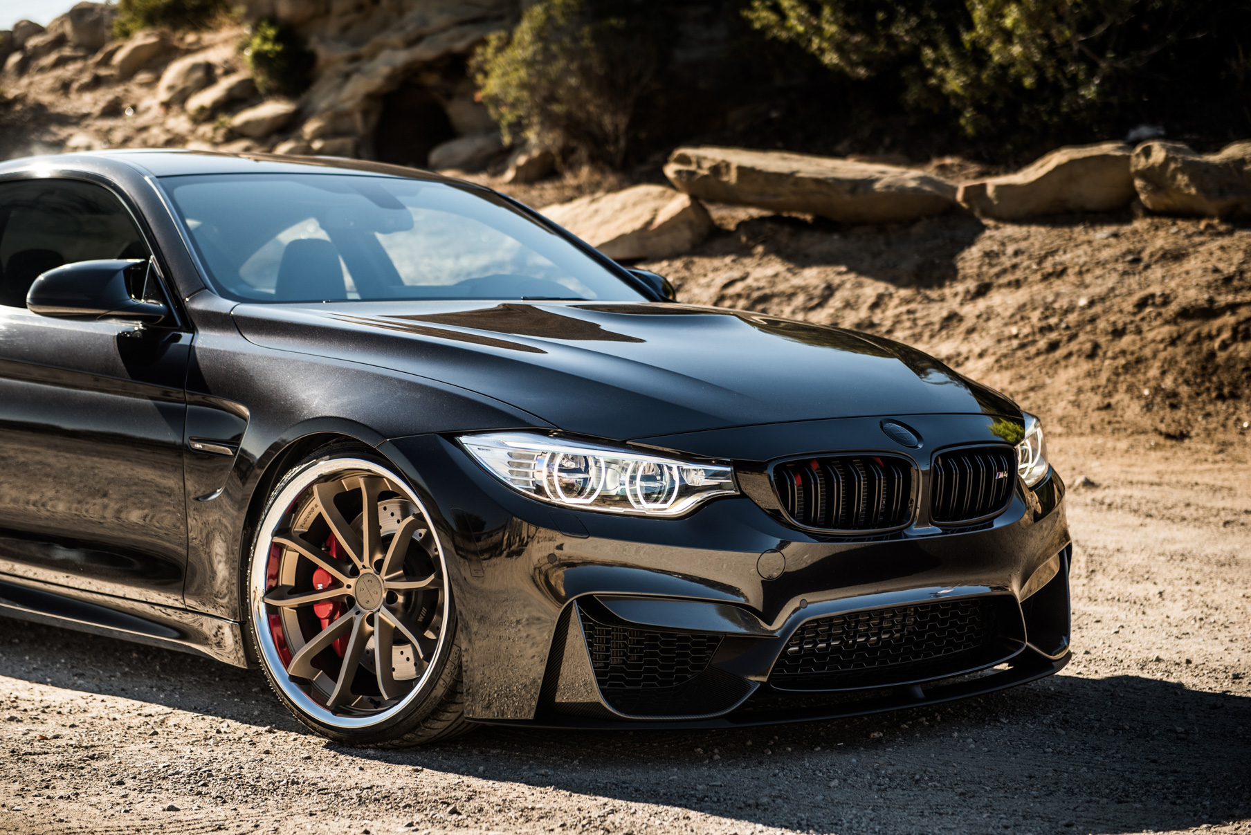 A 2015 BMW M4 on Staggered Blaque Diamond BD-23 Matte Bronze Wheels