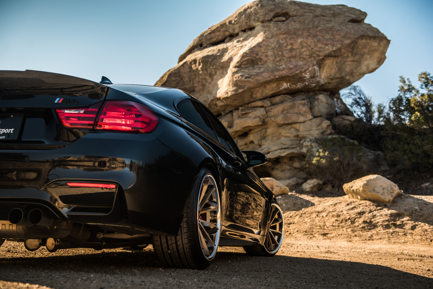 A 2015 BMW M4 on Staggered Blaque Diamond BD-23 Matte Bronze Wheels