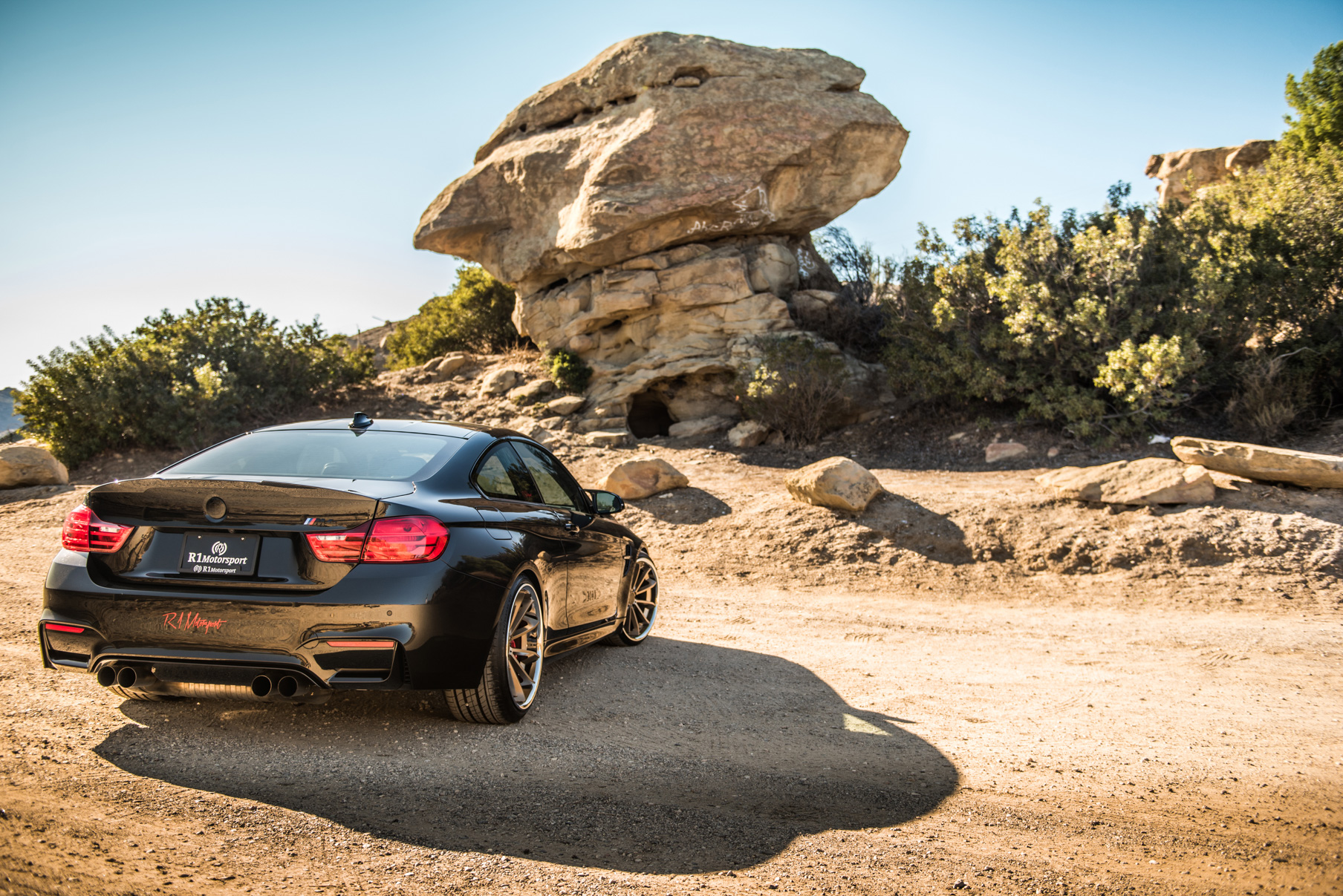 A 2015 BMW M4 on Staggered Blaque Diamond BD-23 Matte Bronze Wheels