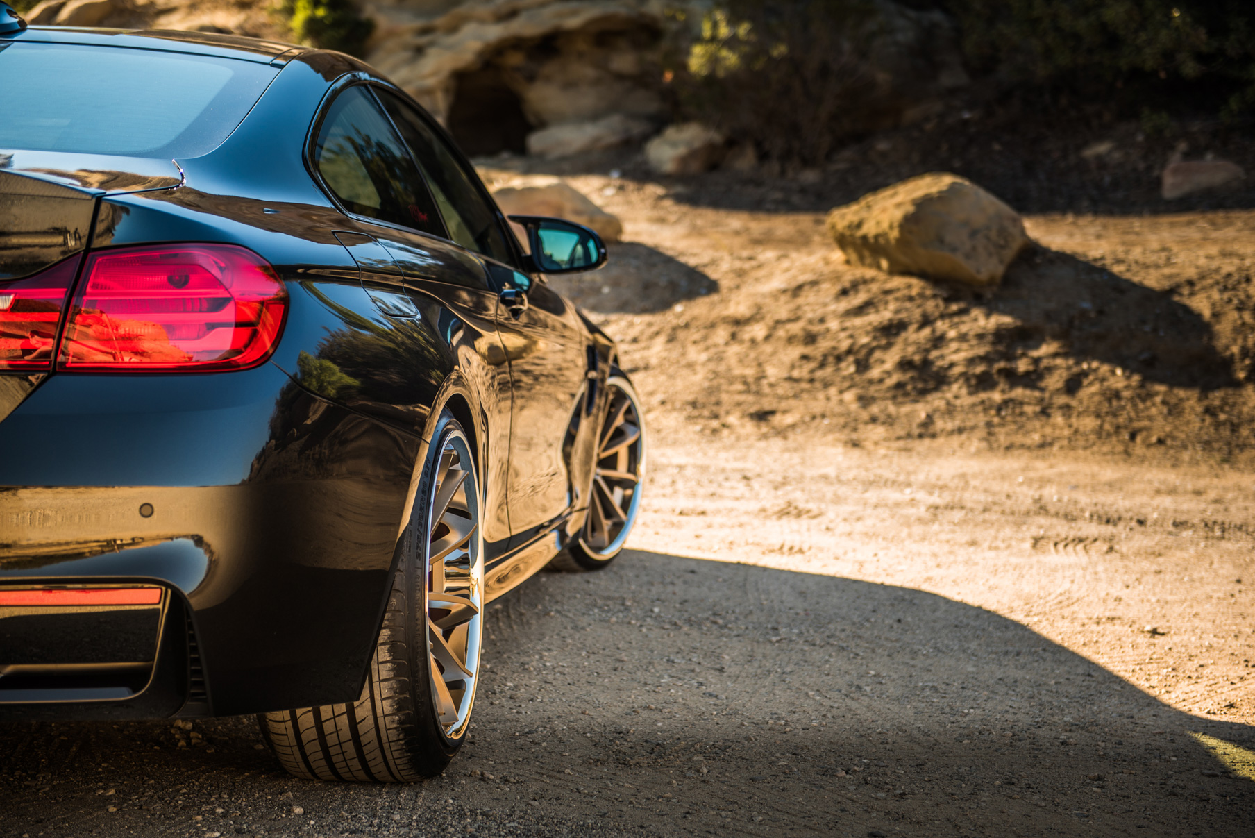 A 2015 BMW M4 on Staggered Blaque Diamond BD-23 Matte Bronze Wheels