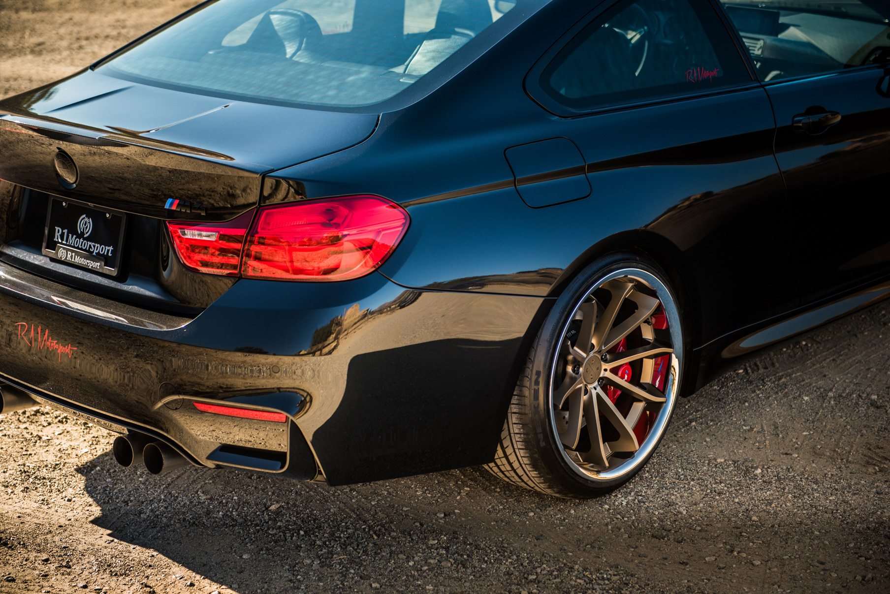 A 2015 BMW M4 on Staggered Blaque Diamond BD-23 Matte Bronze Wheels