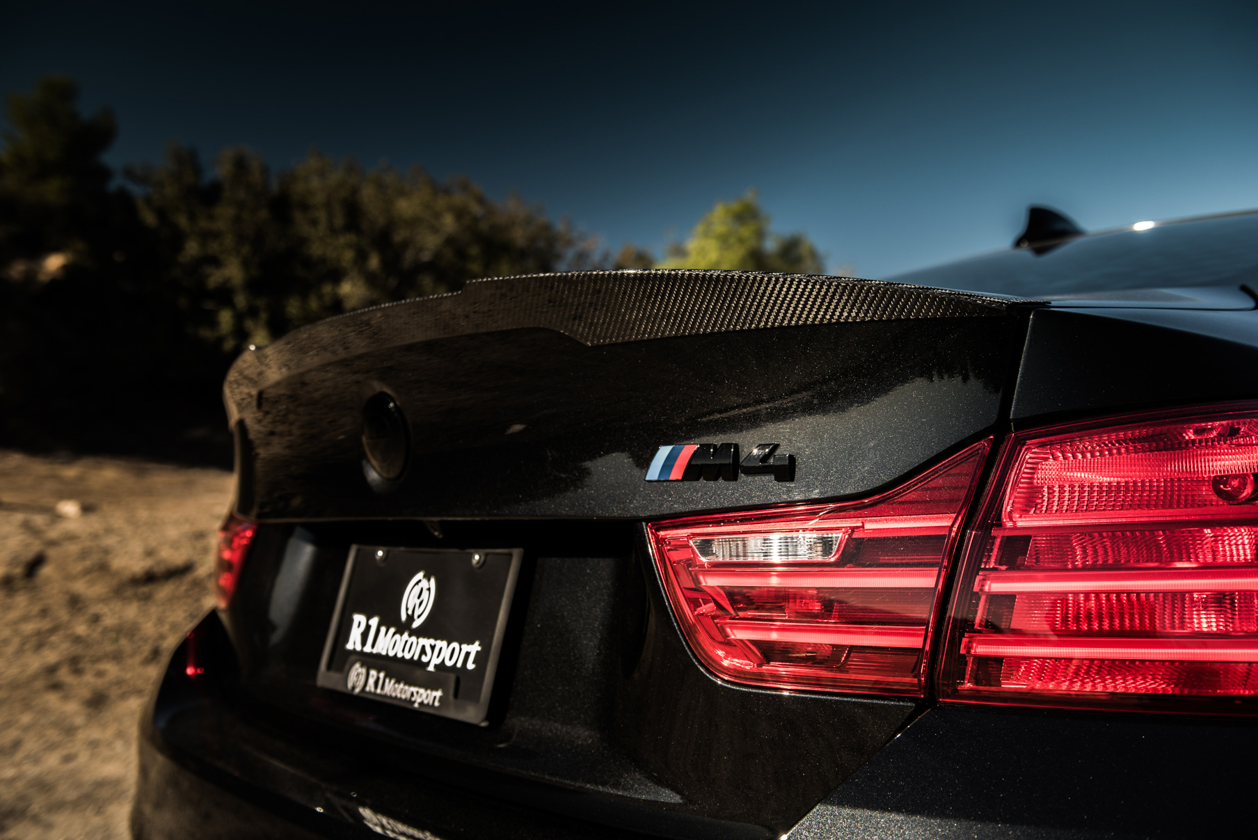 A 2015 BMW M4 on Staggered Blaque Diamond BD-23 Matte Bronze Wheels