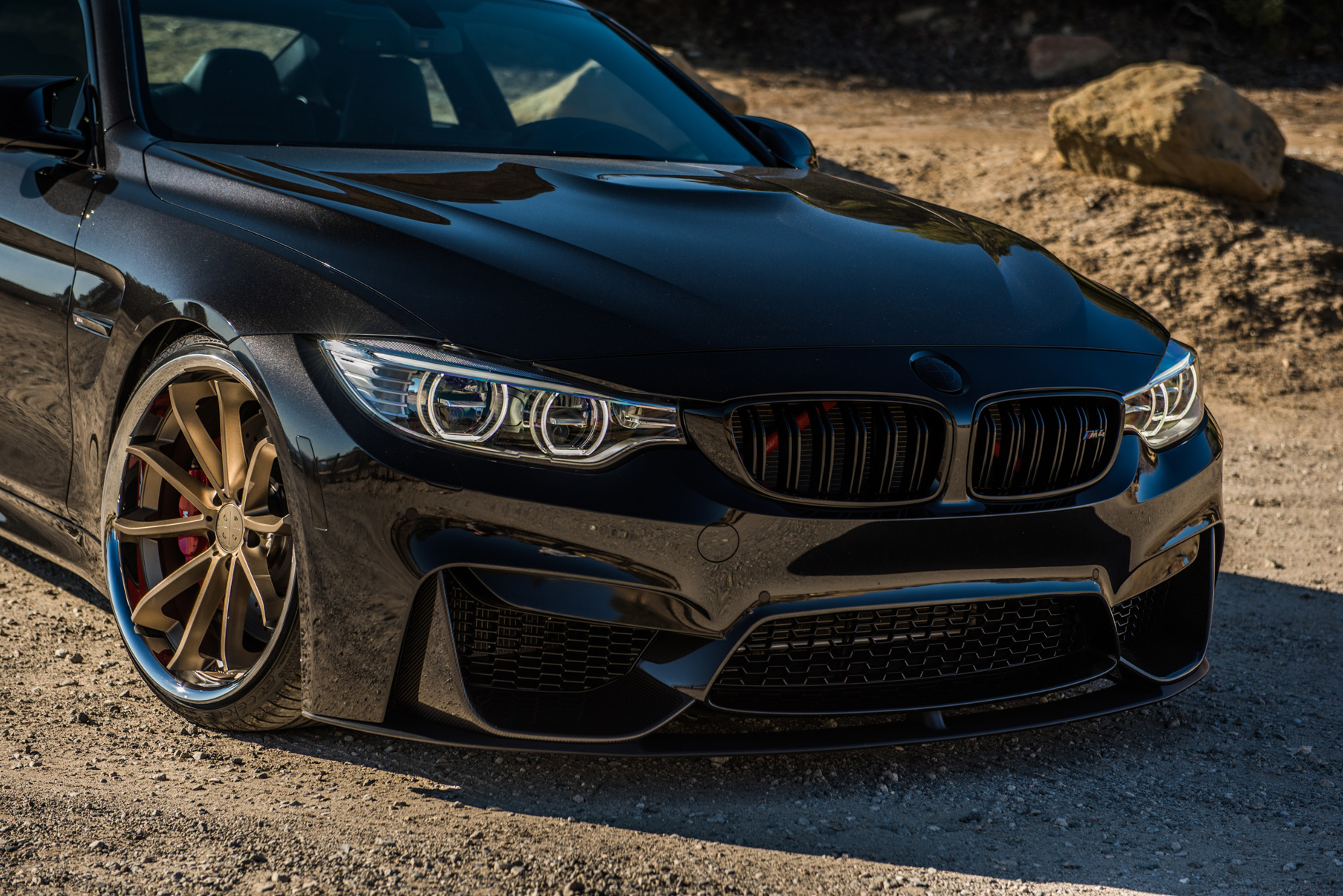 A 2015 BMW M4 on Staggered Blaque Diamond BD-23 Matte Bronze Wheels