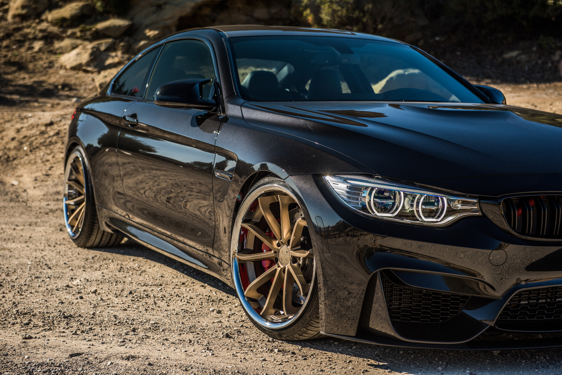 A 2015 BMW M4 on Staggered Blaque Diamond BD-23 Matte Bronze Wheels