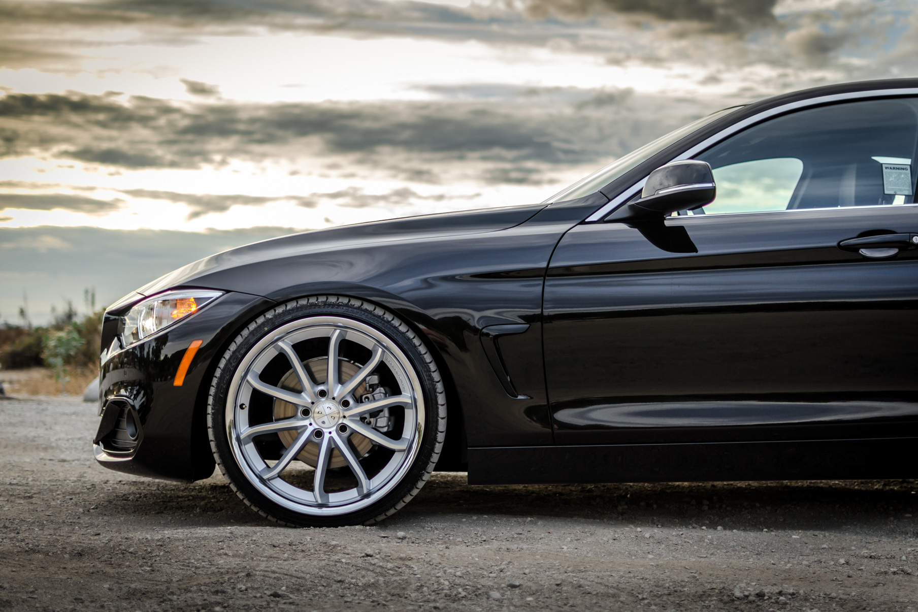 A 2016 BMW 430i on 20 Inch Blaque Diamond BD-23 Silver with Chrome SS Lip Wheels