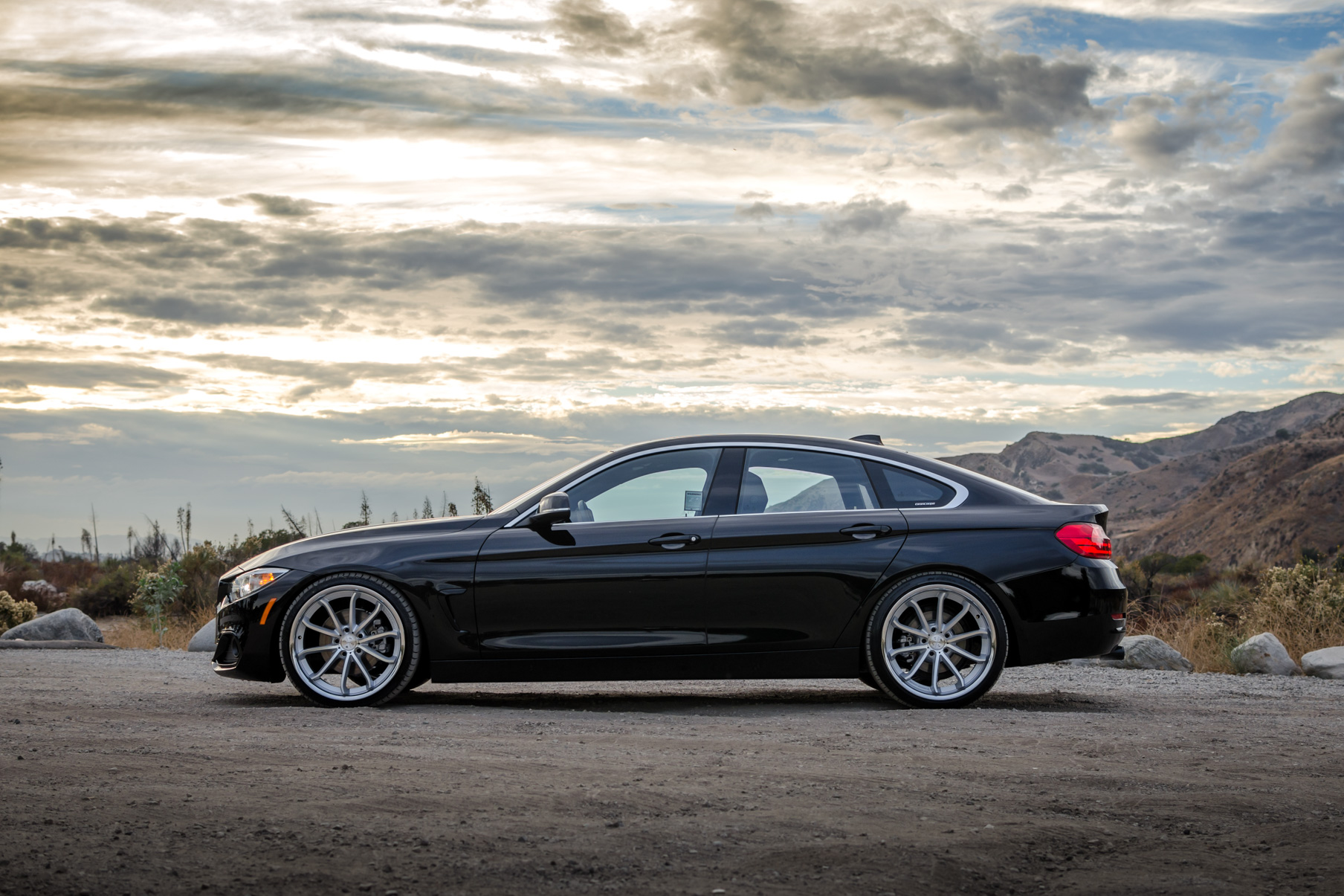 A 2016 BMW 430i on 20 Inch Blaque Diamond BD-23 Silver with Chrome SS Lip Wheels