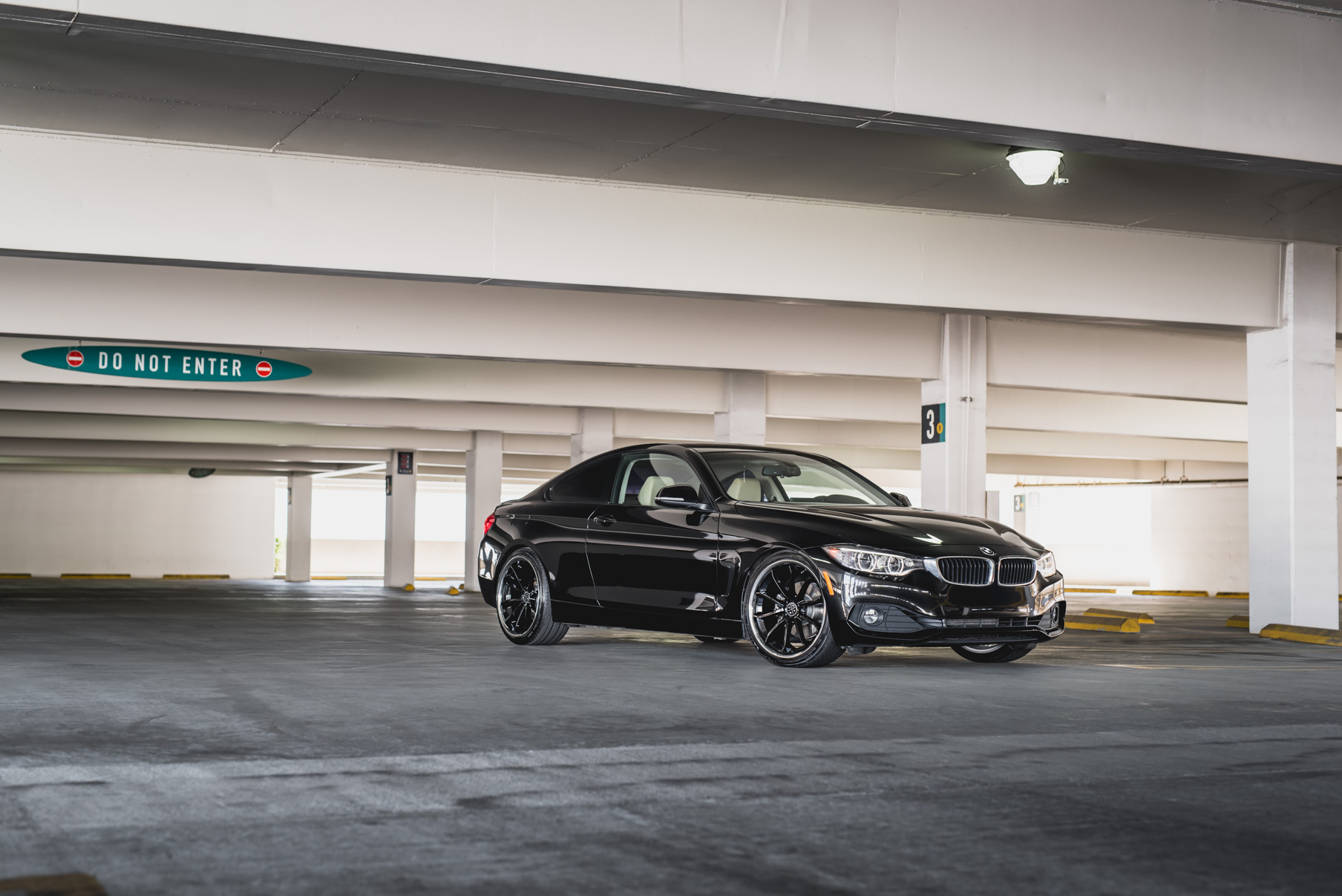 A 2014 BMW 428i on Staggered Blaque Diamond BD-23 Black with Chrome Lip Wheels
