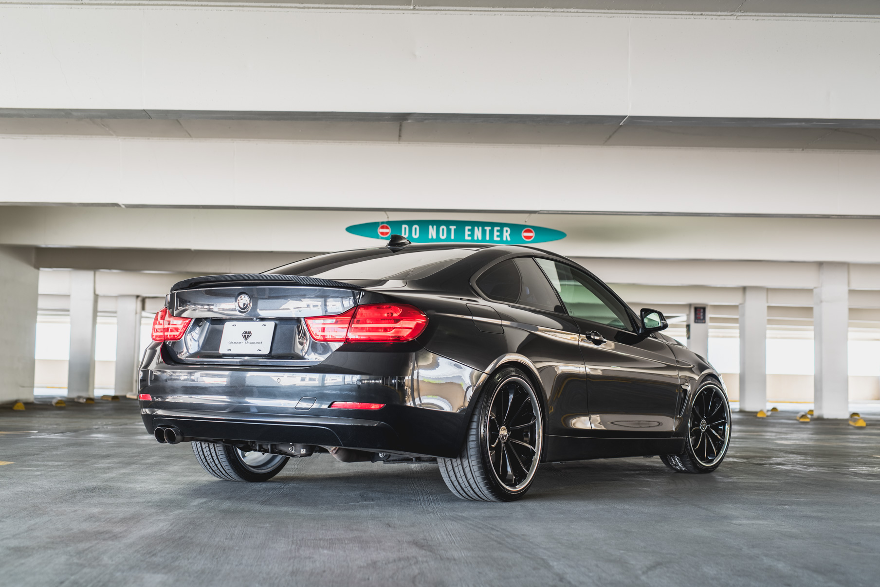 A 2014 BMW 428i on Staggered Blaque Diamond BD-23 Black with Chrome Lip Wheels