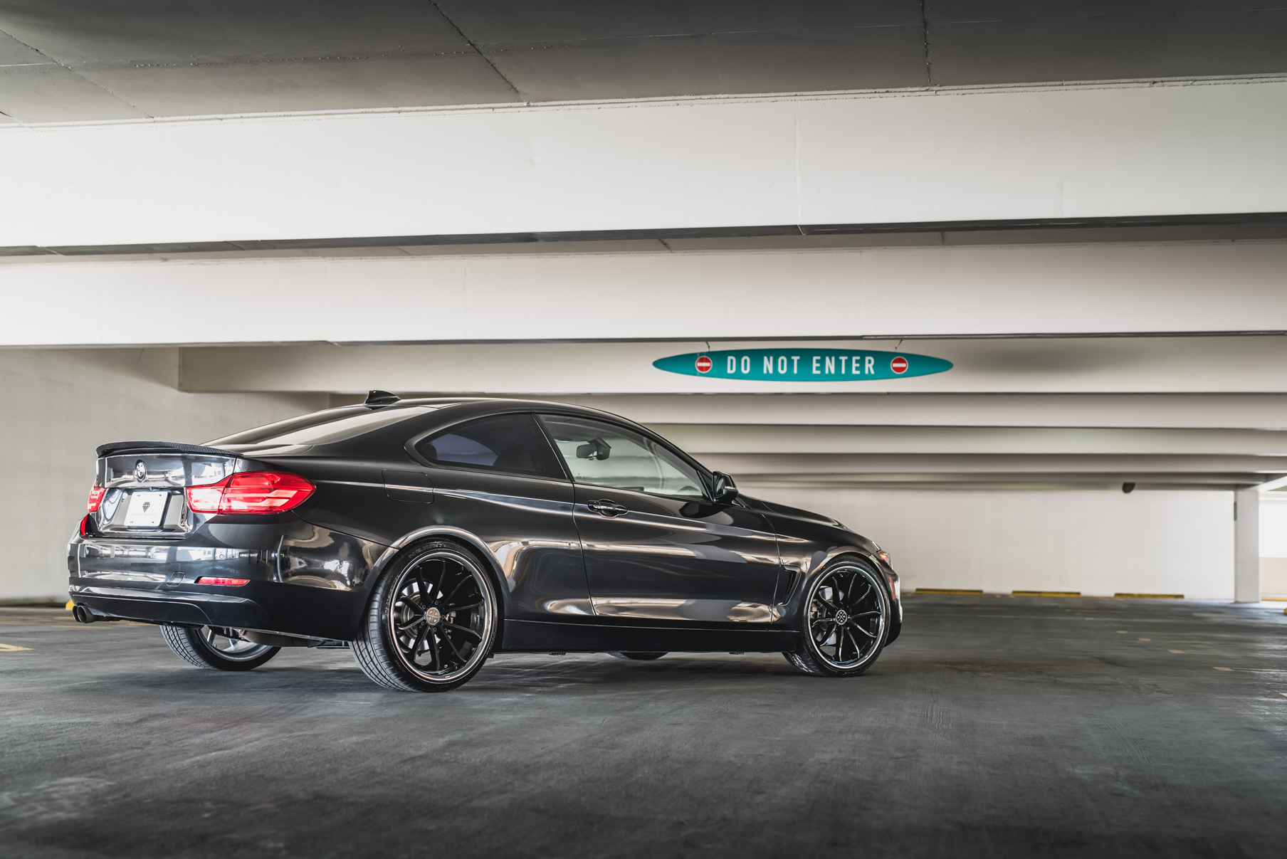 A 2014 BMW 428i on Staggered Blaque Diamond BD-23 Black with Chrome Lip Wheels