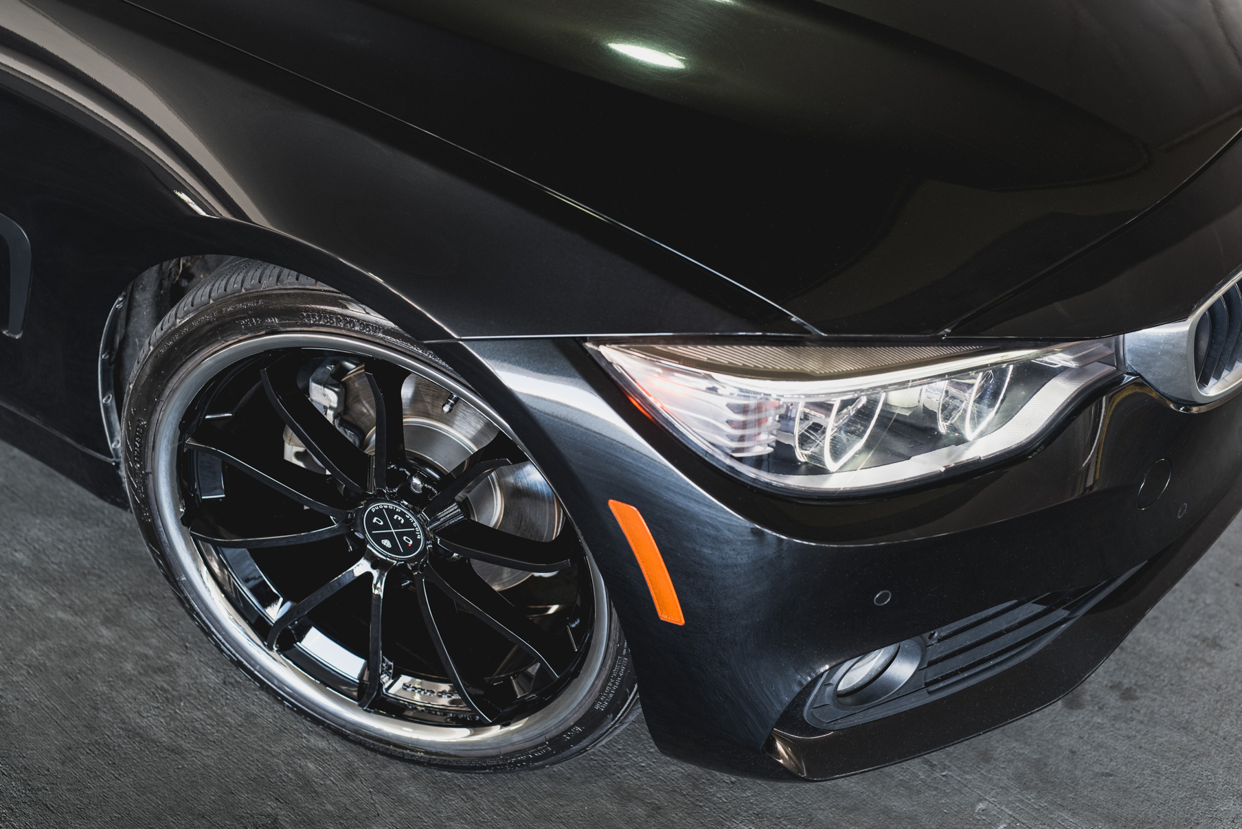 A 2014 BMW 428i on Staggered Blaque Diamond BD-23 Black with Chrome Lip Wheels