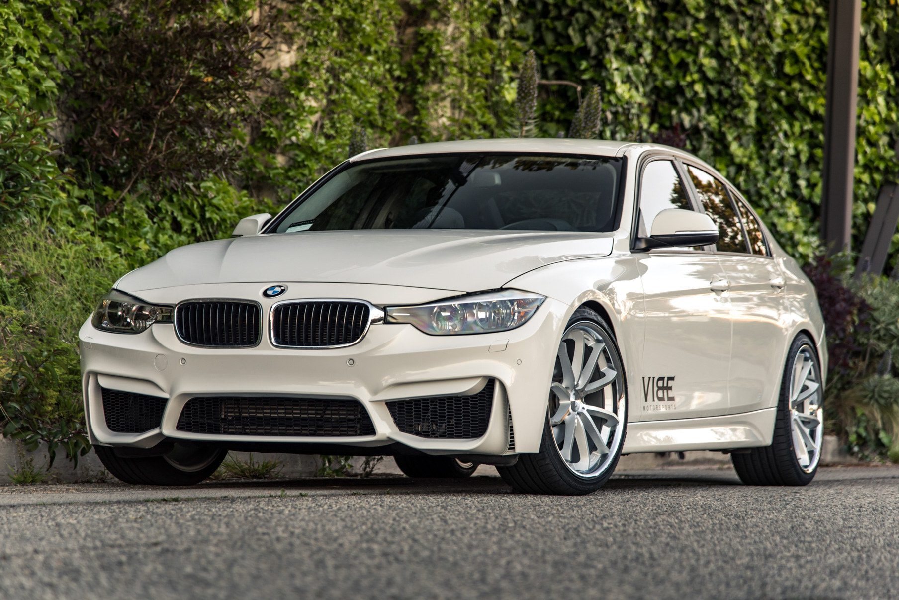 A 2014 BMW 328i on 20 Inch Staggered Silver with Chrome SS Lip Wheels