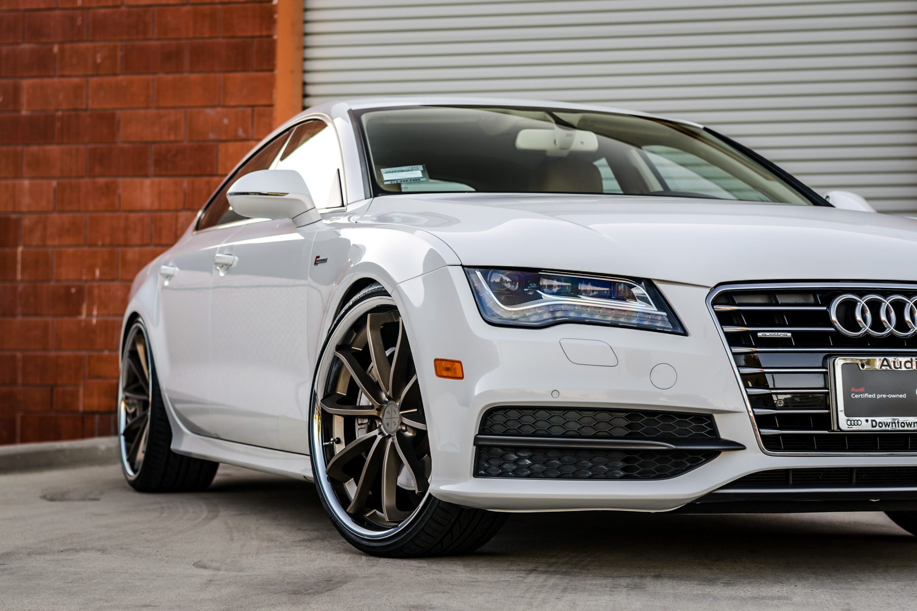 A White 2016 Audi A7 on 20 Inch Blaque Diamond BD-23 Bronze with Chrome SS Lip Wheels