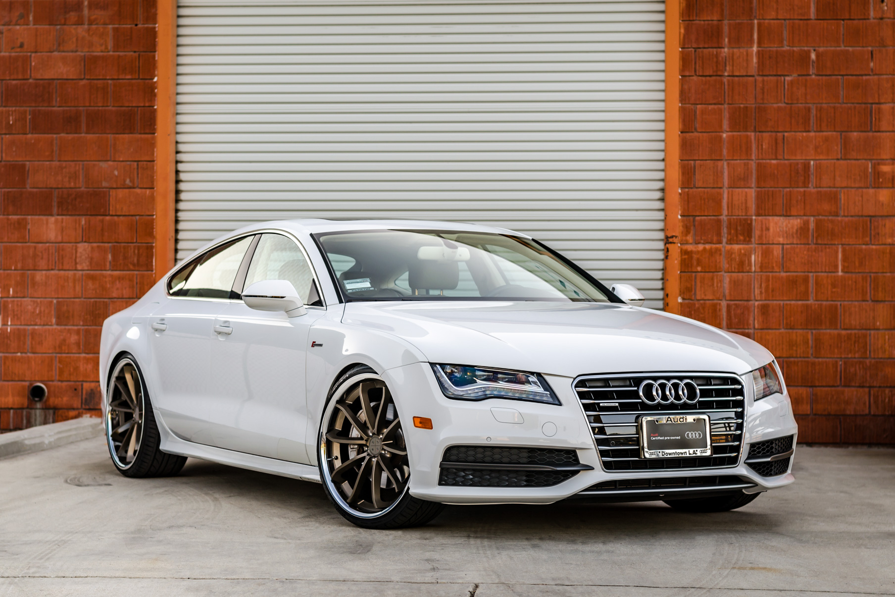 A White 2016 Audi A7 on 20 Inch Blaque Diamond BD-23 Bronze with Chrome SS Lip Wheels